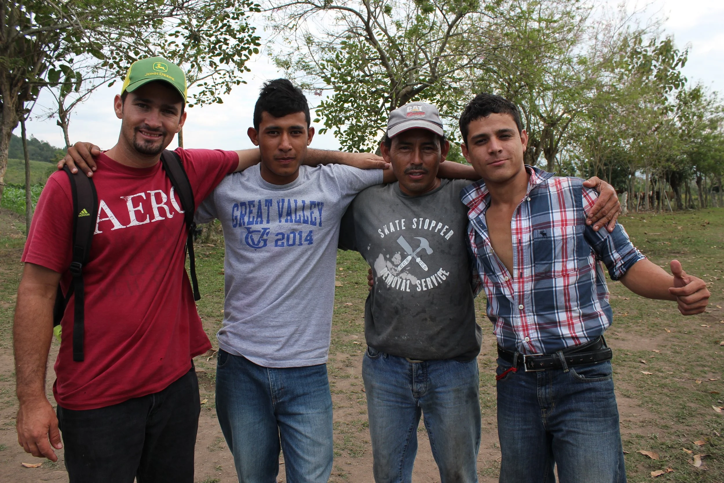 Sergio, in the red shirt on the left, with one of the employees that works in 'agro' and two of the 'jovenes' that help out in 'agro.'