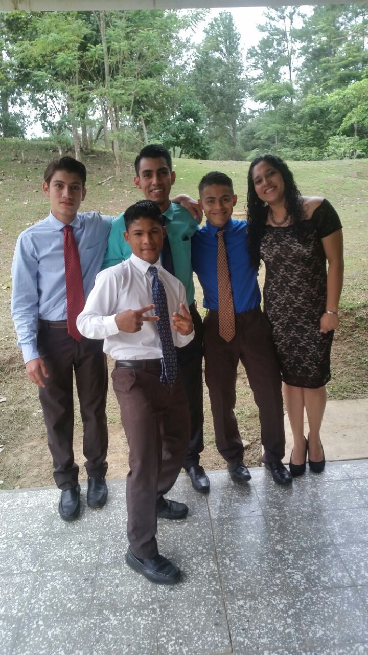 Pictured on the right, Profe Evelyn poses with a fellow teacher and three boys who graduated from 6th grade this past December.