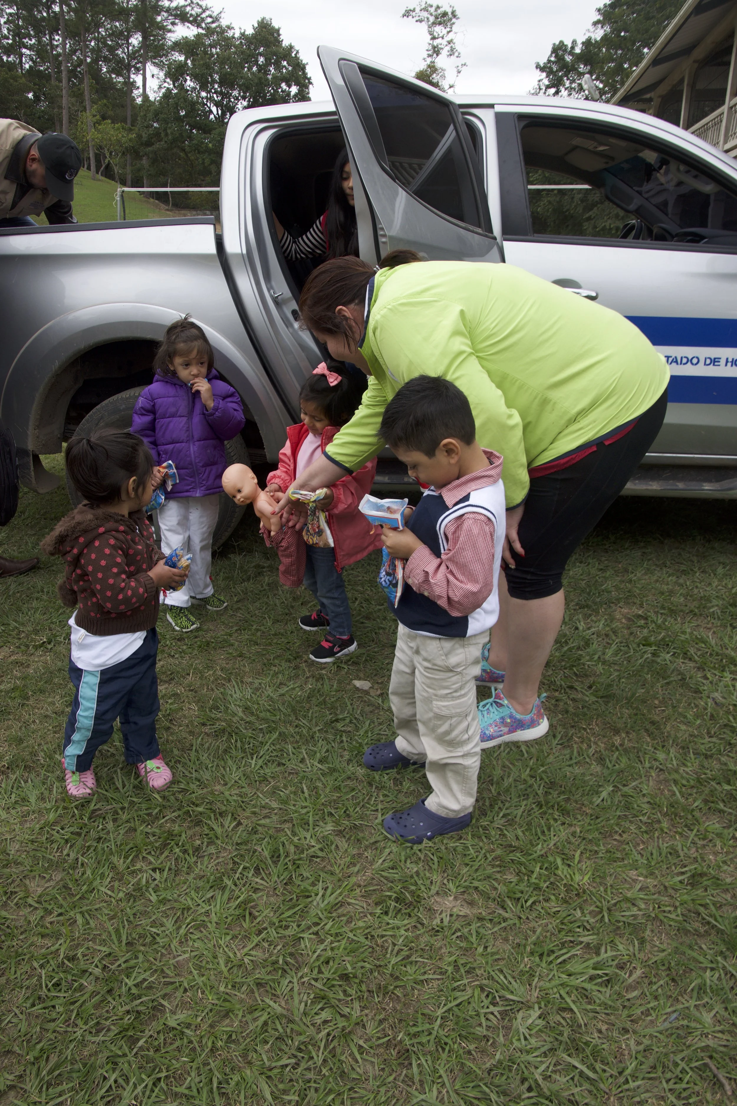 Suyapa welcoming some of our newest family members home on their first day at Amigos.