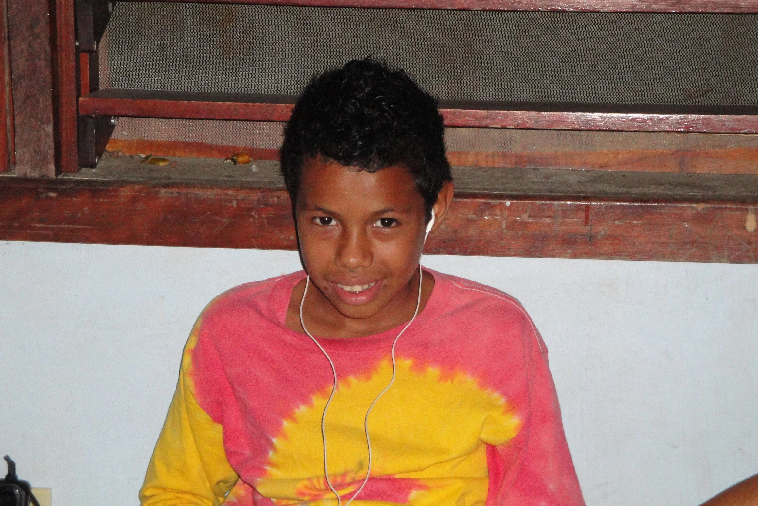 Conrad enjoying some time to relax by listening to music.
