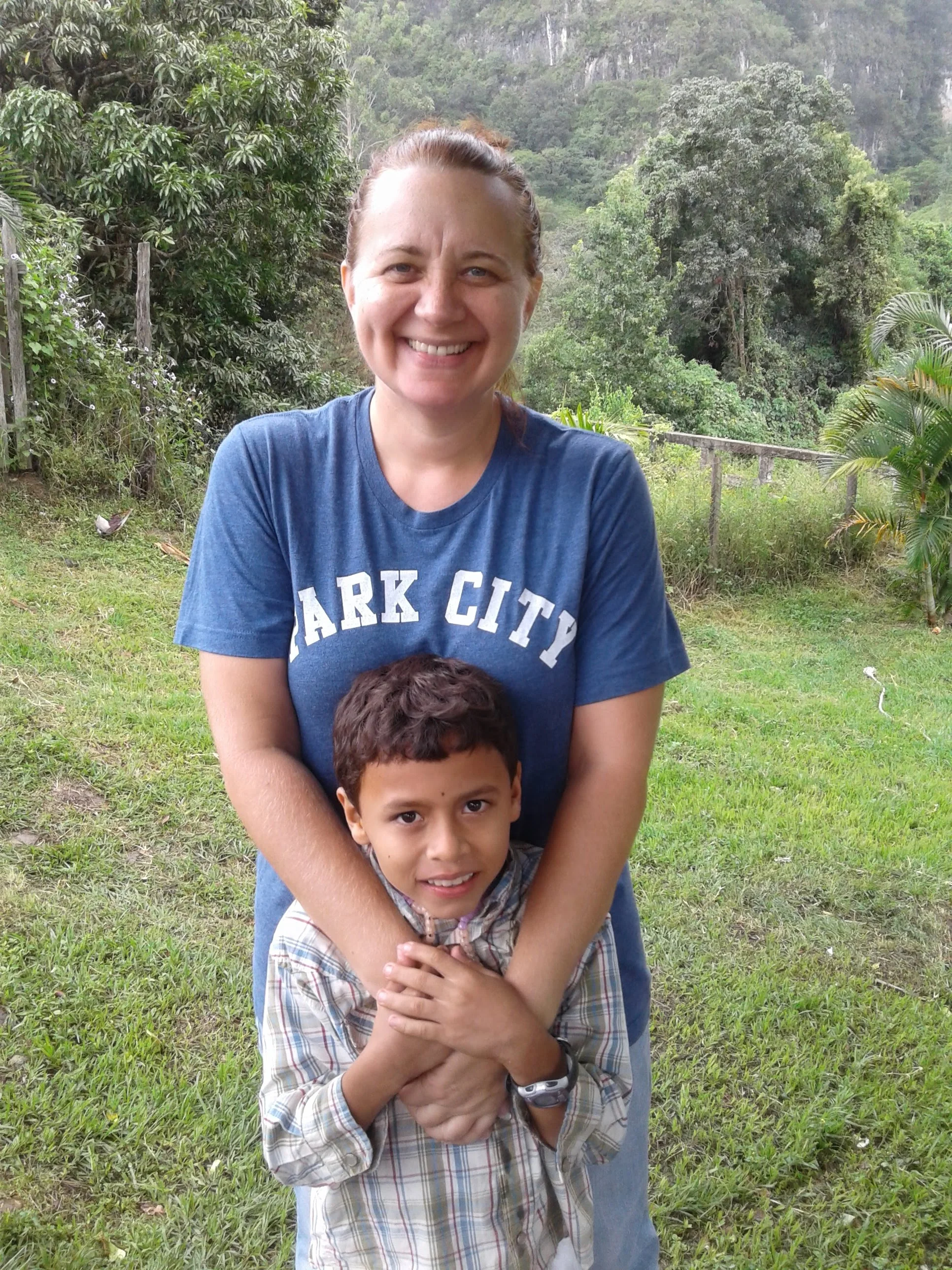 Genevieve and Arturo exploring a park on vacation together.