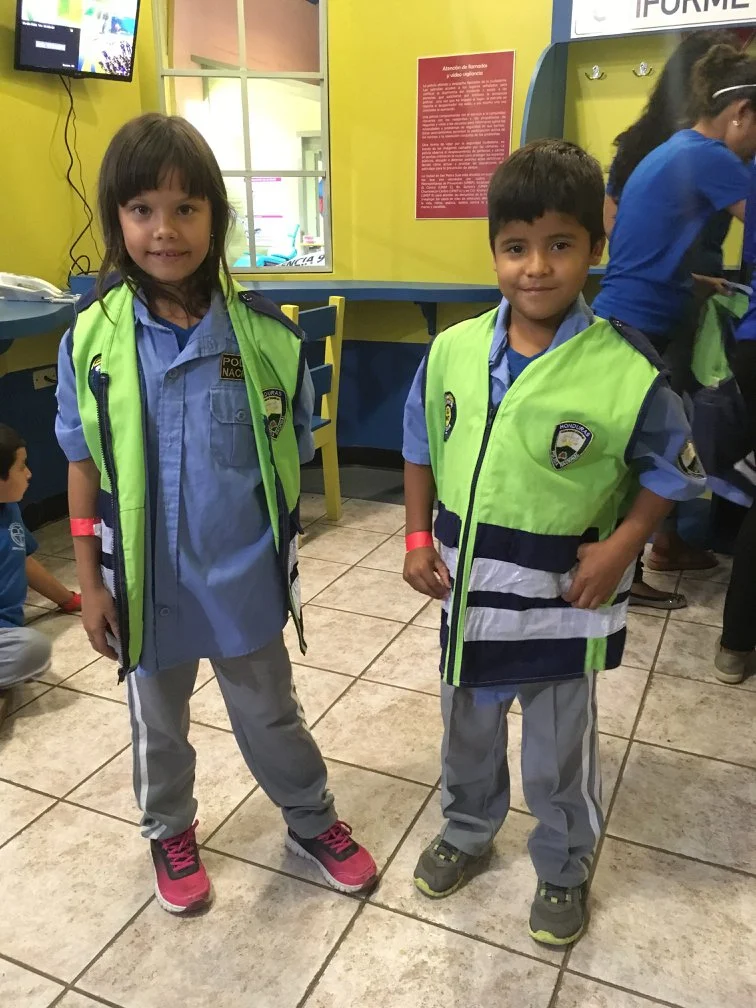 Checking out the policemen uniforms at the children’s museum during his class excursion last year.