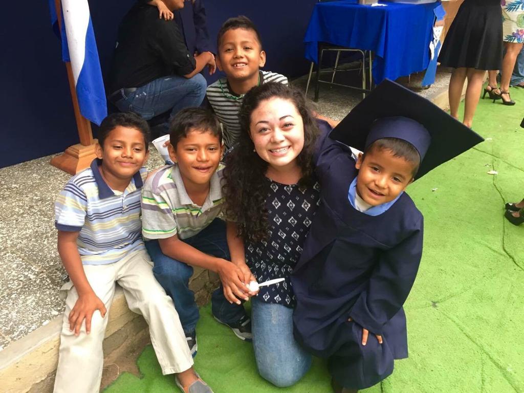 Ignacio’s graduation from kindergarten 3 years ago! His brother Damian is seated to the left of Ms. Amelia.