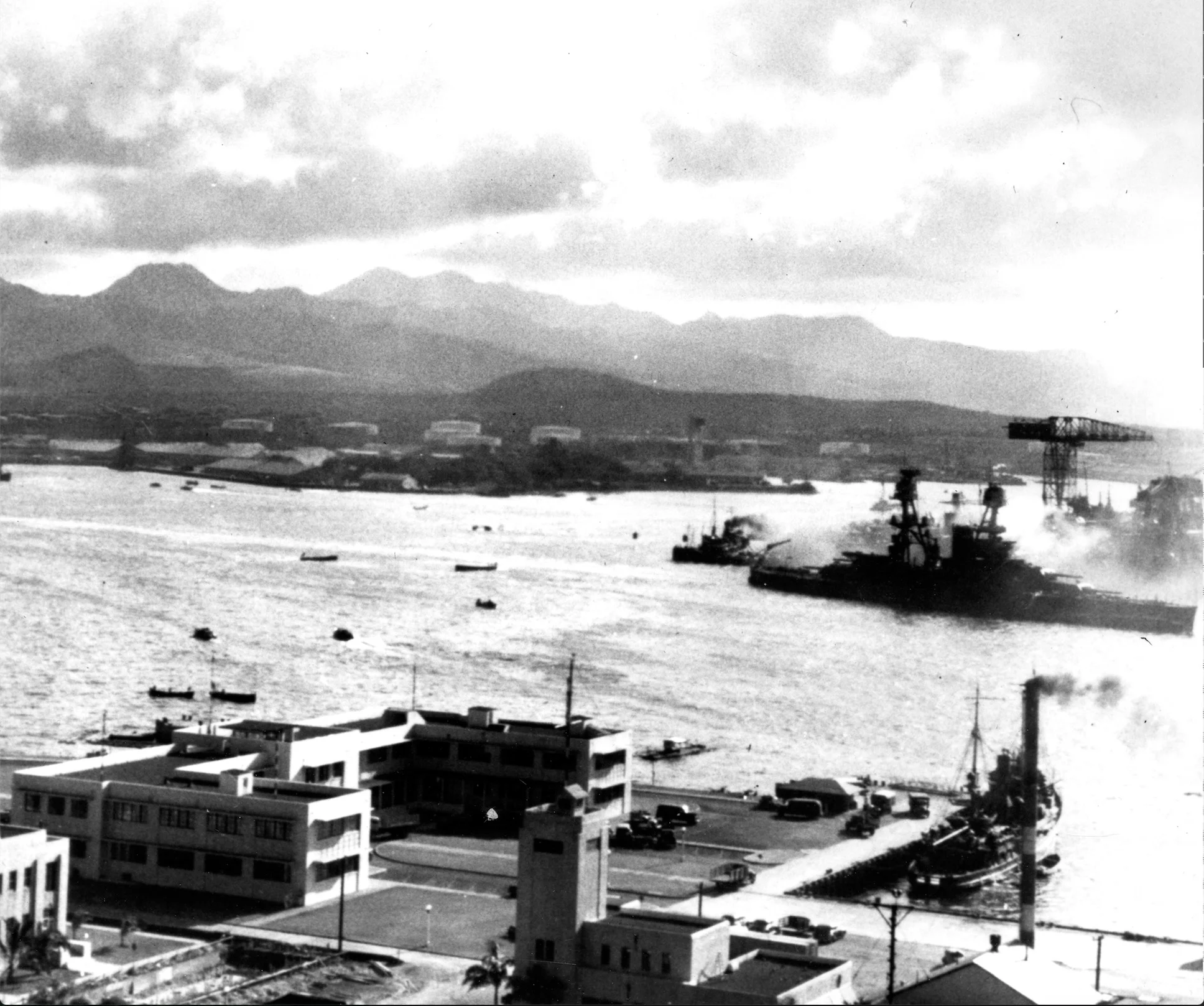 Book Figure 25. USS Nevada near 1010 dock heading toward the ocean. Ensign Sherertz and fellow ensigns on board. Taken from Ford Island. US Navy National Archives (Photo # 97397).