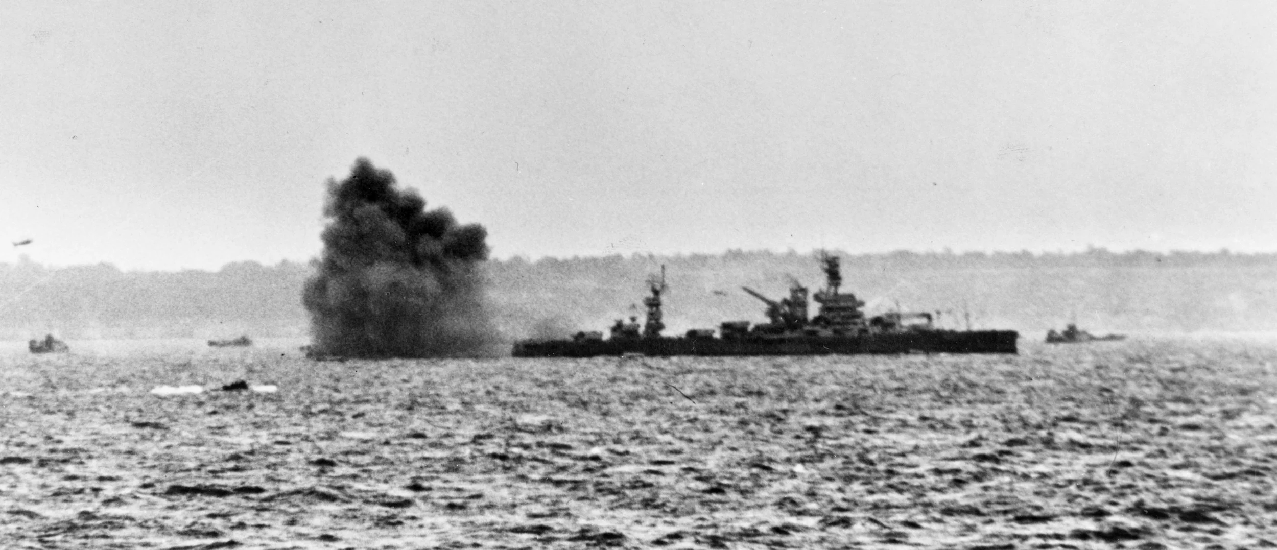 Book Figure 79. USS Arkansas bombarding Omaha Beach on D-Day.