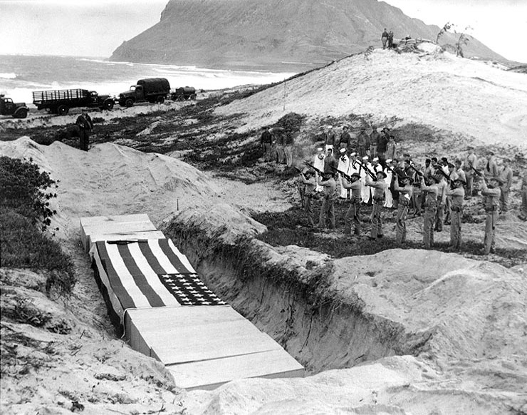 Book Figure 28. Mass grave burial ceremony on December 8th 1941 after Japanese attack. These men were killed at Naval Air Station Kanoehe Bay. Largest number of men buried at Punchbowl Cemetery.