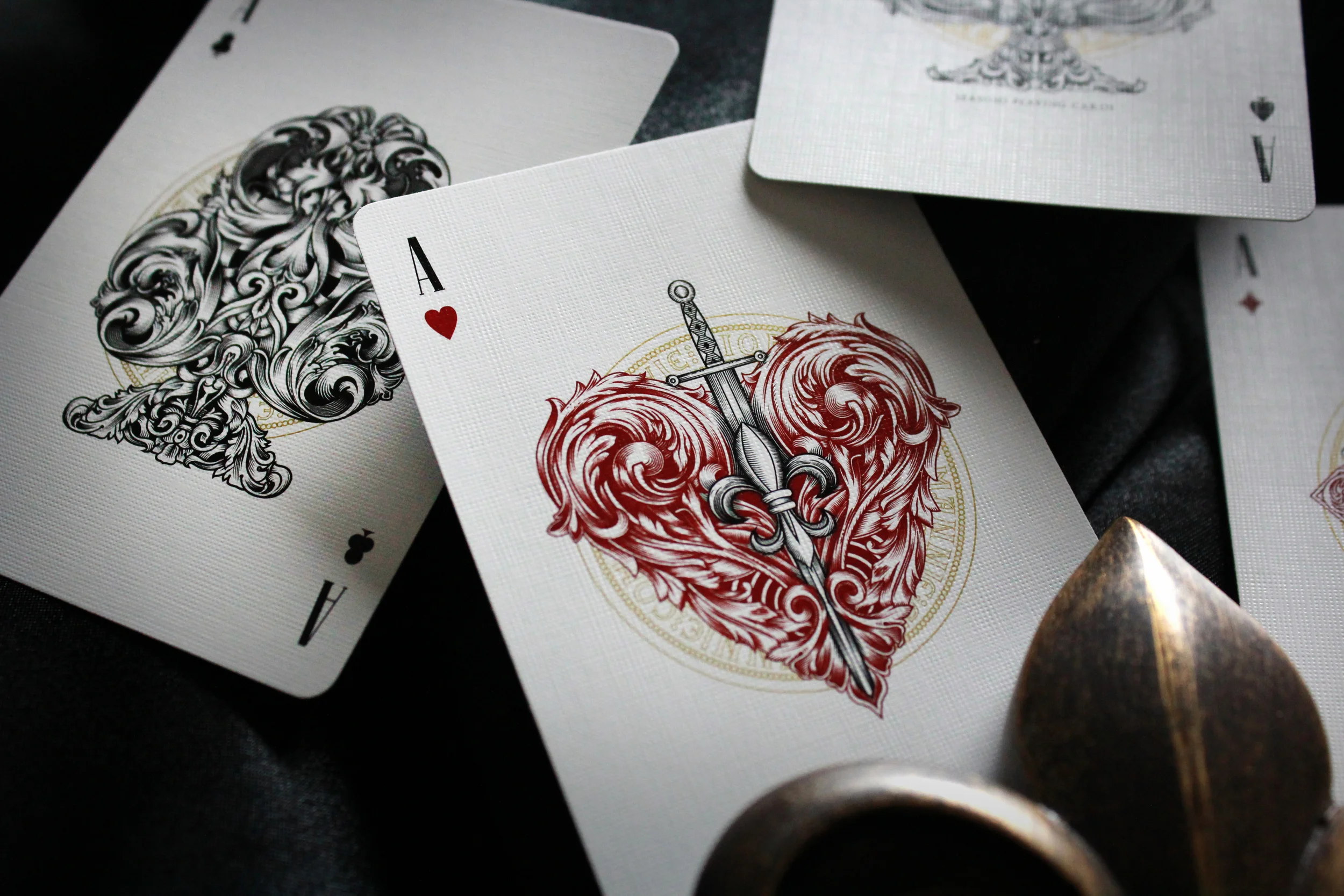  Each suit carries symbolism based on the court card family that each represents. The Club hides a lion face representing the Angevin Empire and a sword skewers the Heart adorning the fleur de lis for Louis VIII. 