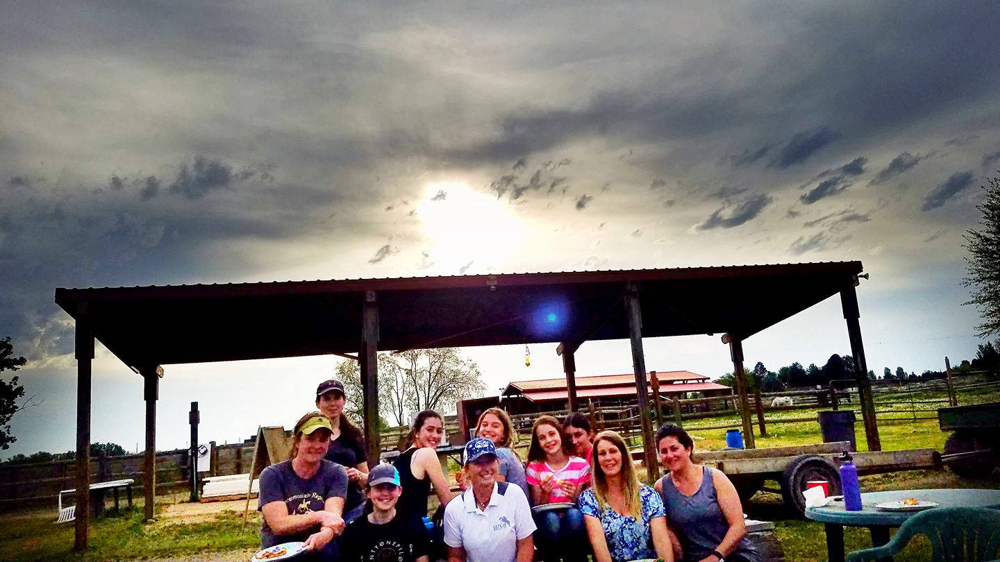 Hot, sweaty, tired, and about to get rained on, still making the effort