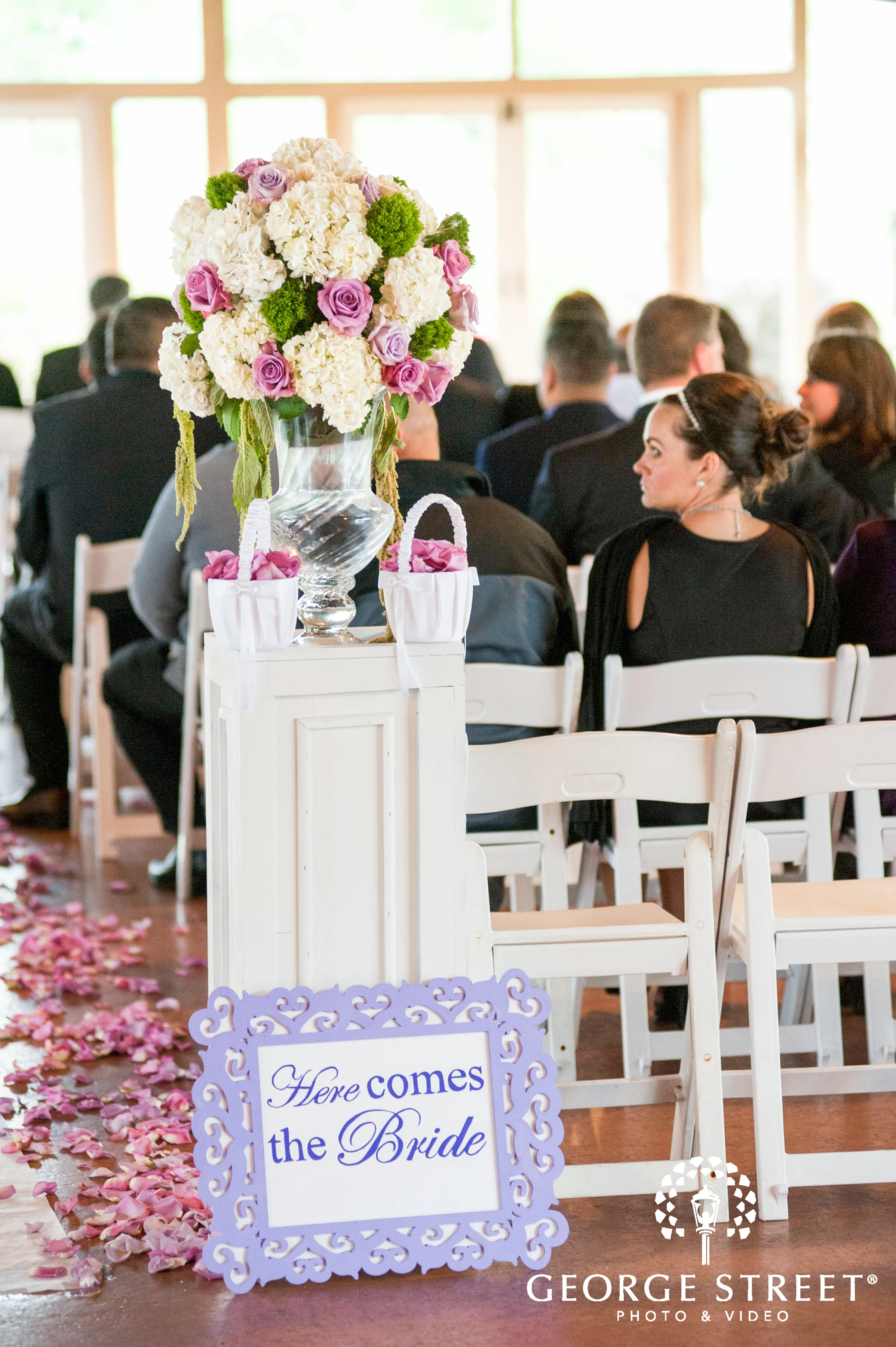  Here comes the Bride sign and ceremony arrangement  Image by George Street Photo &amp; Video  