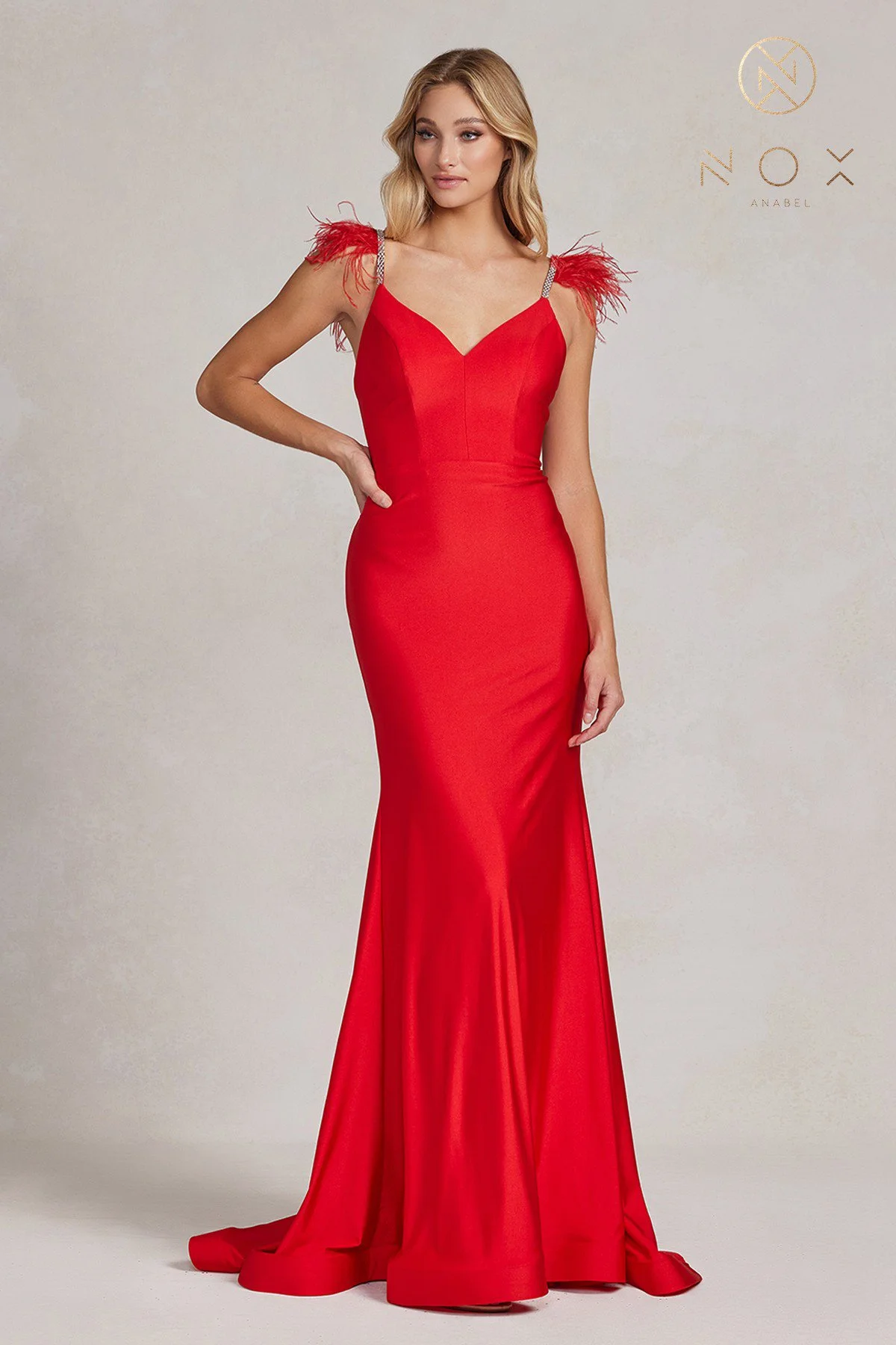 Make a statement in this captivating red trumpet prom dress, embodying timeless beauty and grace.