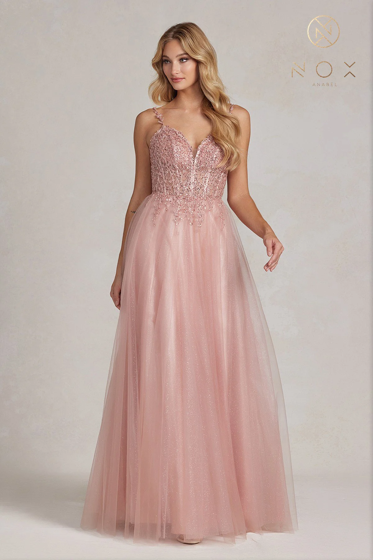 Step into the spotlight with this glamorous rose gold prom dress, radiating confidence and sophistication.
