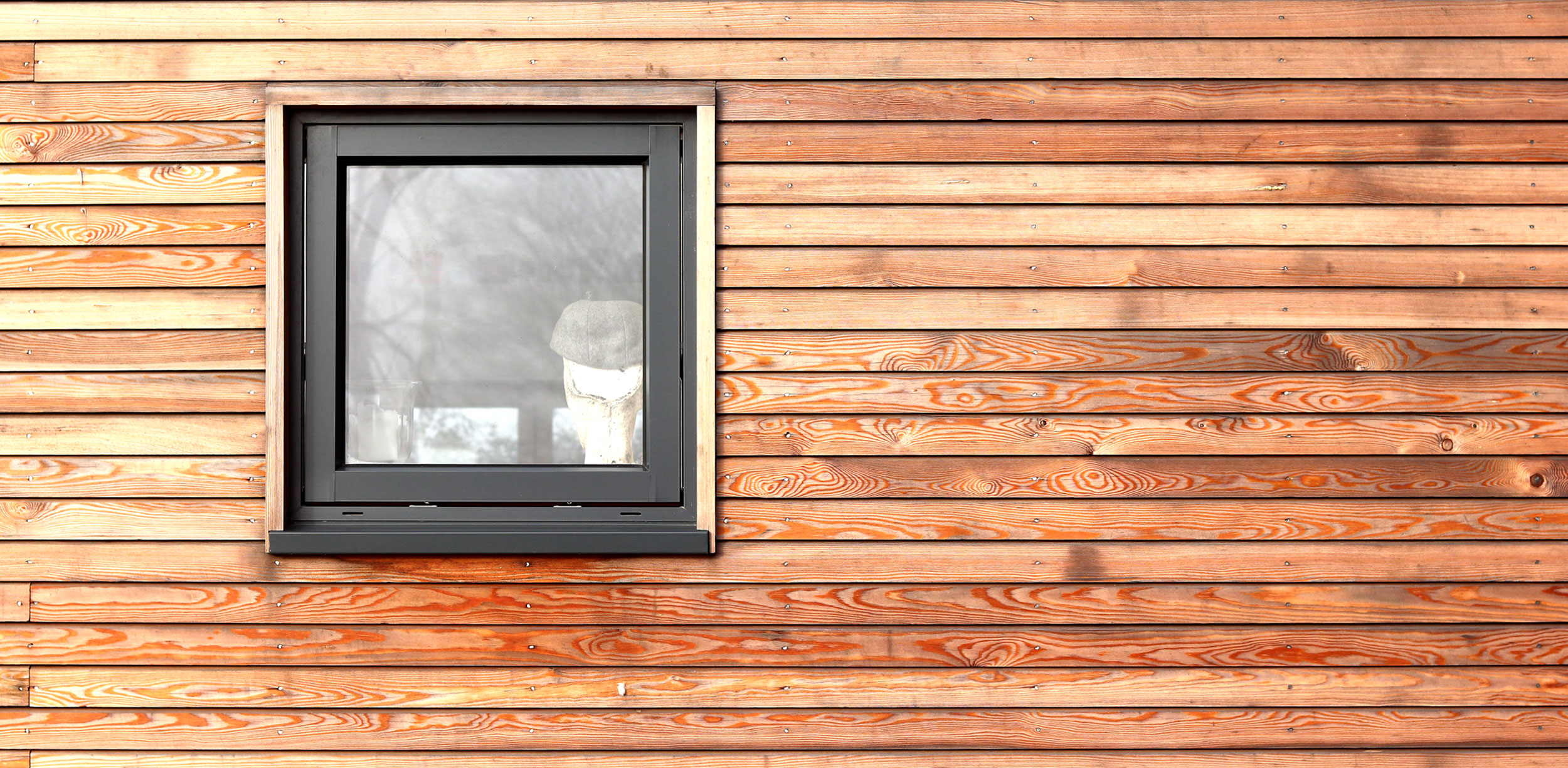 siberian larch cladding with shadow gap and aluminium clad timber framed window