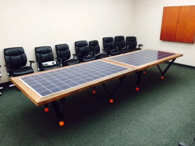  Two redwood and steel tables with photovoltaic panels for a solar company. In collaboration with Philip Pasqualino. 