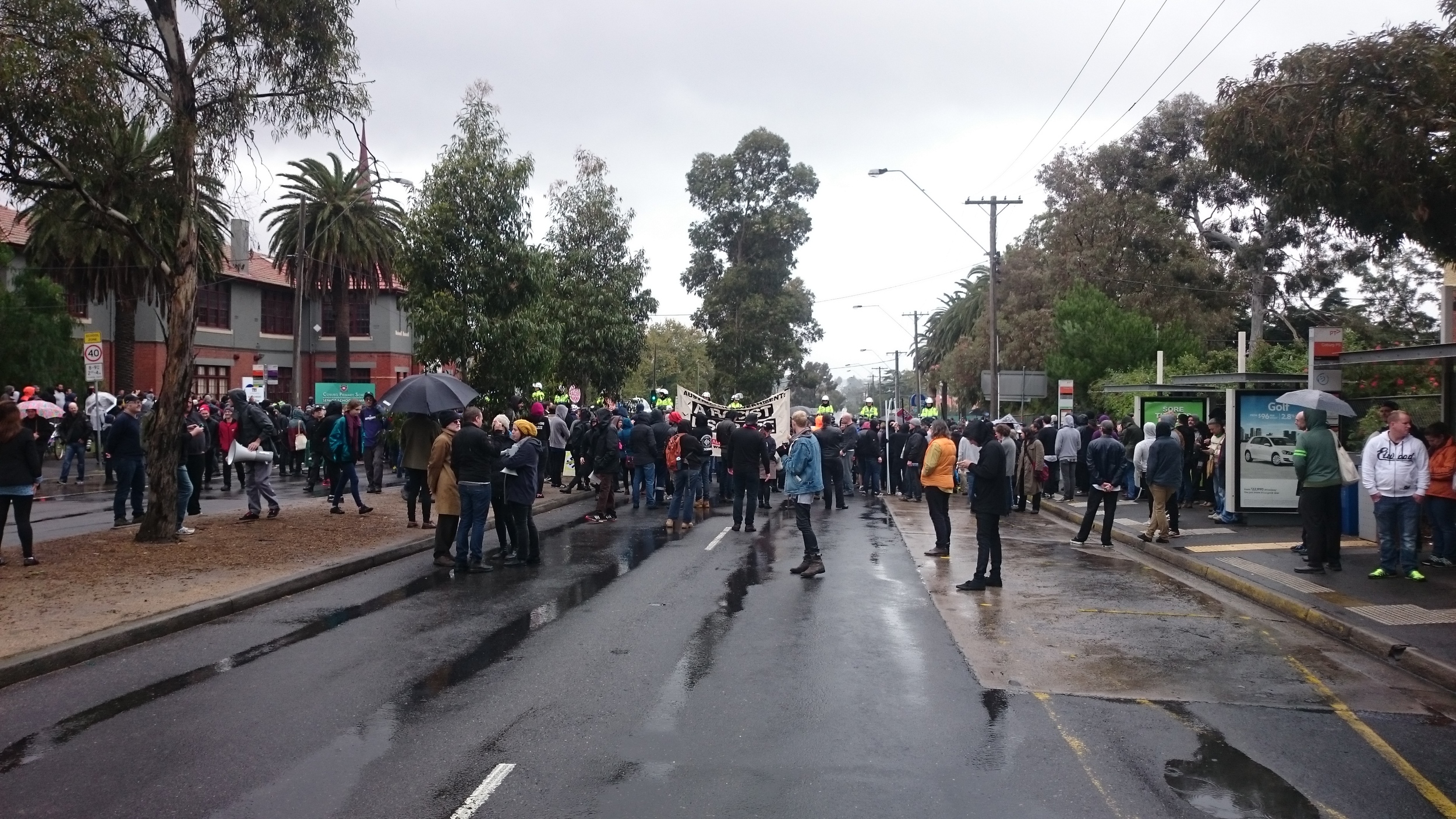 Behind the left-wing group blocking Bell St.