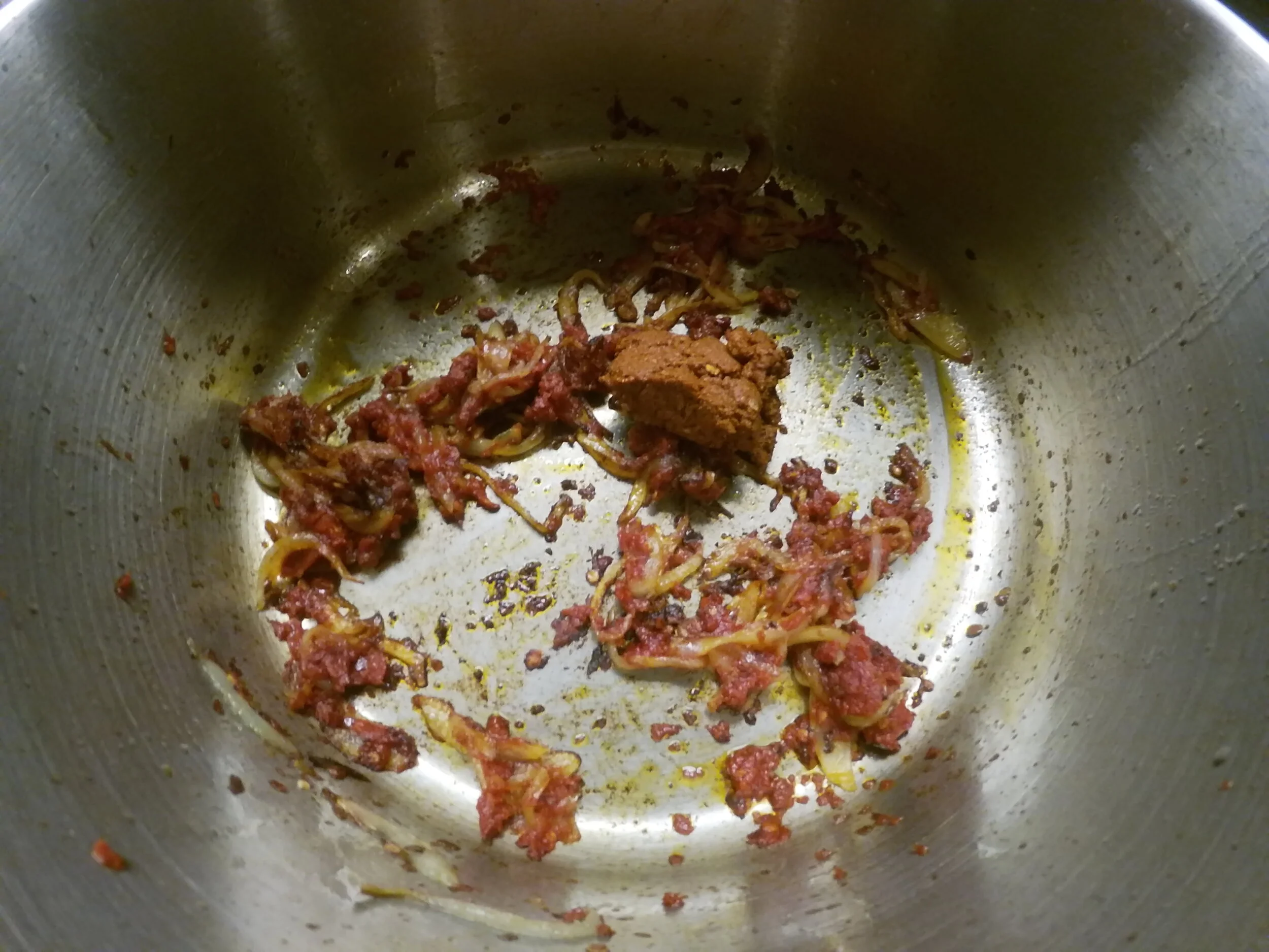 8. Add tomato paste and spice mixture