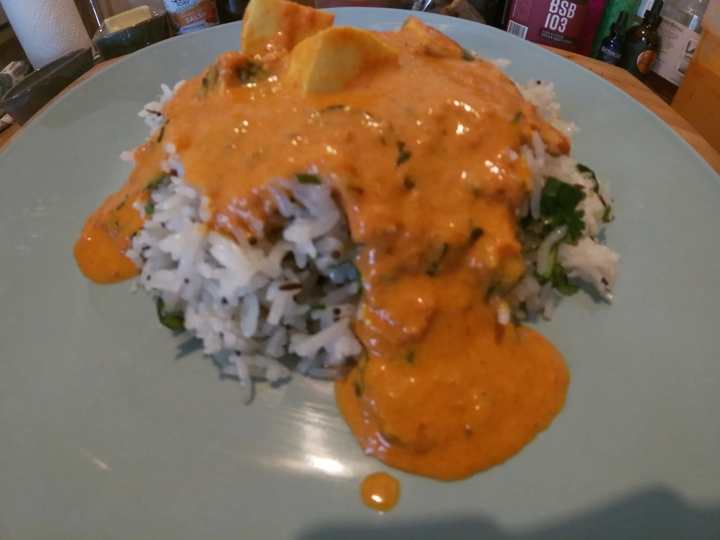 15. Plate rice and ladle tikka masala on top