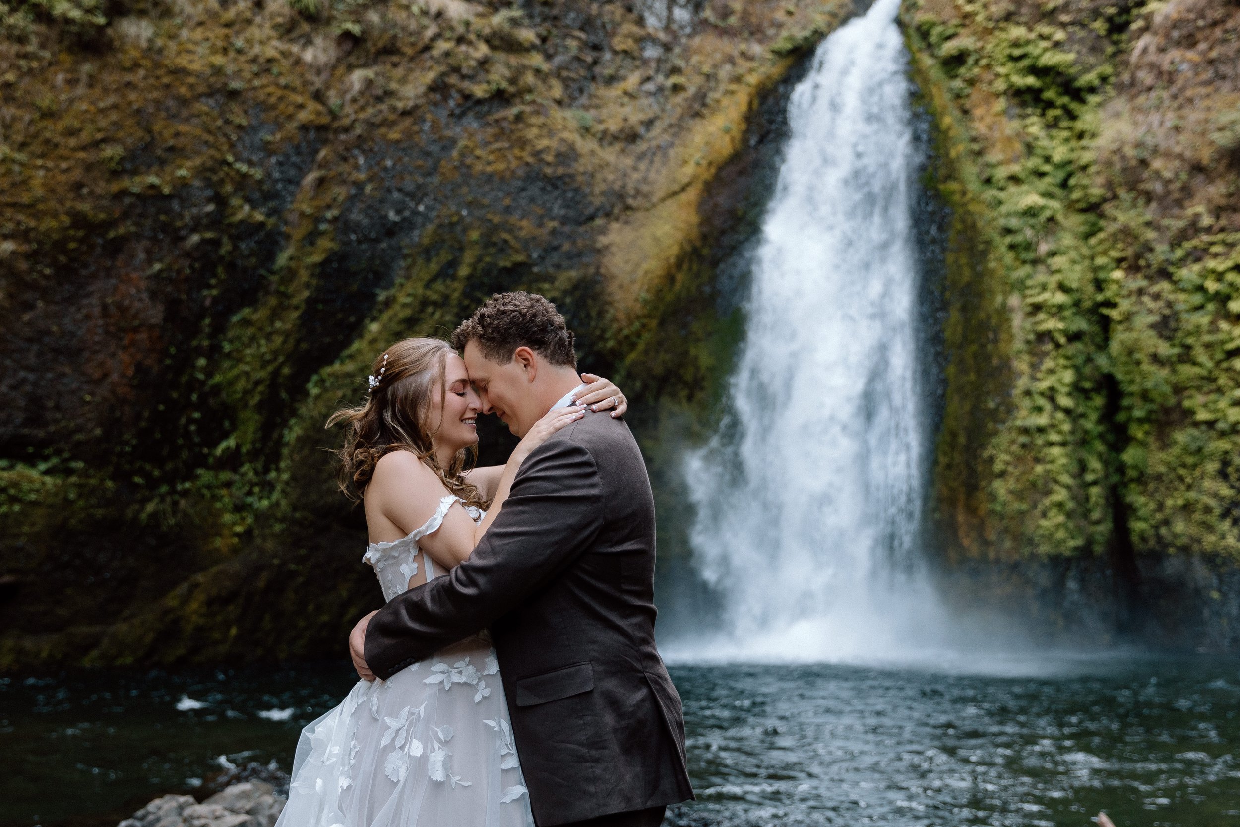 Couple during their Wahclella Falls elopement