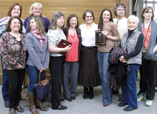 The group accepting the Mayor's Art Organization Award in 2013