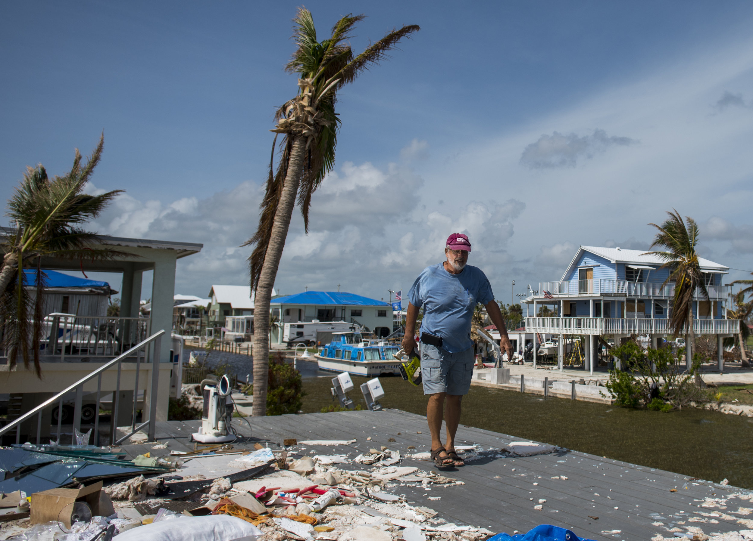  Charlie's home was not the only one to be destroyed during Hurricane Irma's pass through Big Pine Key. A house just up the road is missing half of its structure from the crashing waves and the two homes adjacent to Charlie's have extensive damage fr