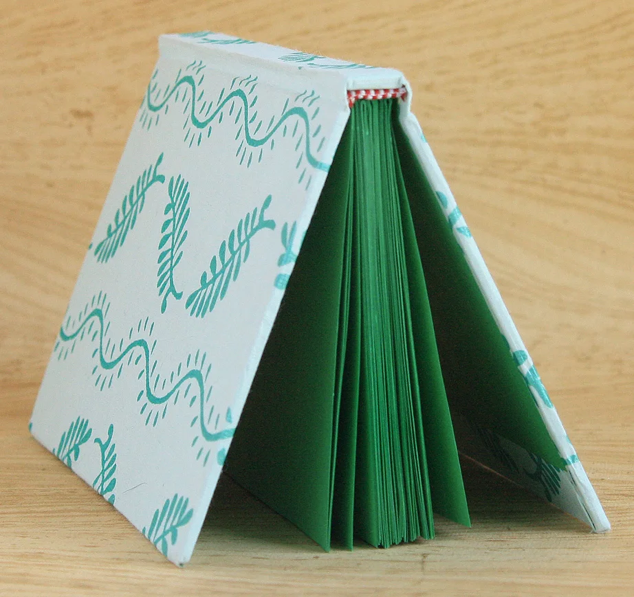 teal-leaf-print-journal-cased-in-open-on-side.jpg