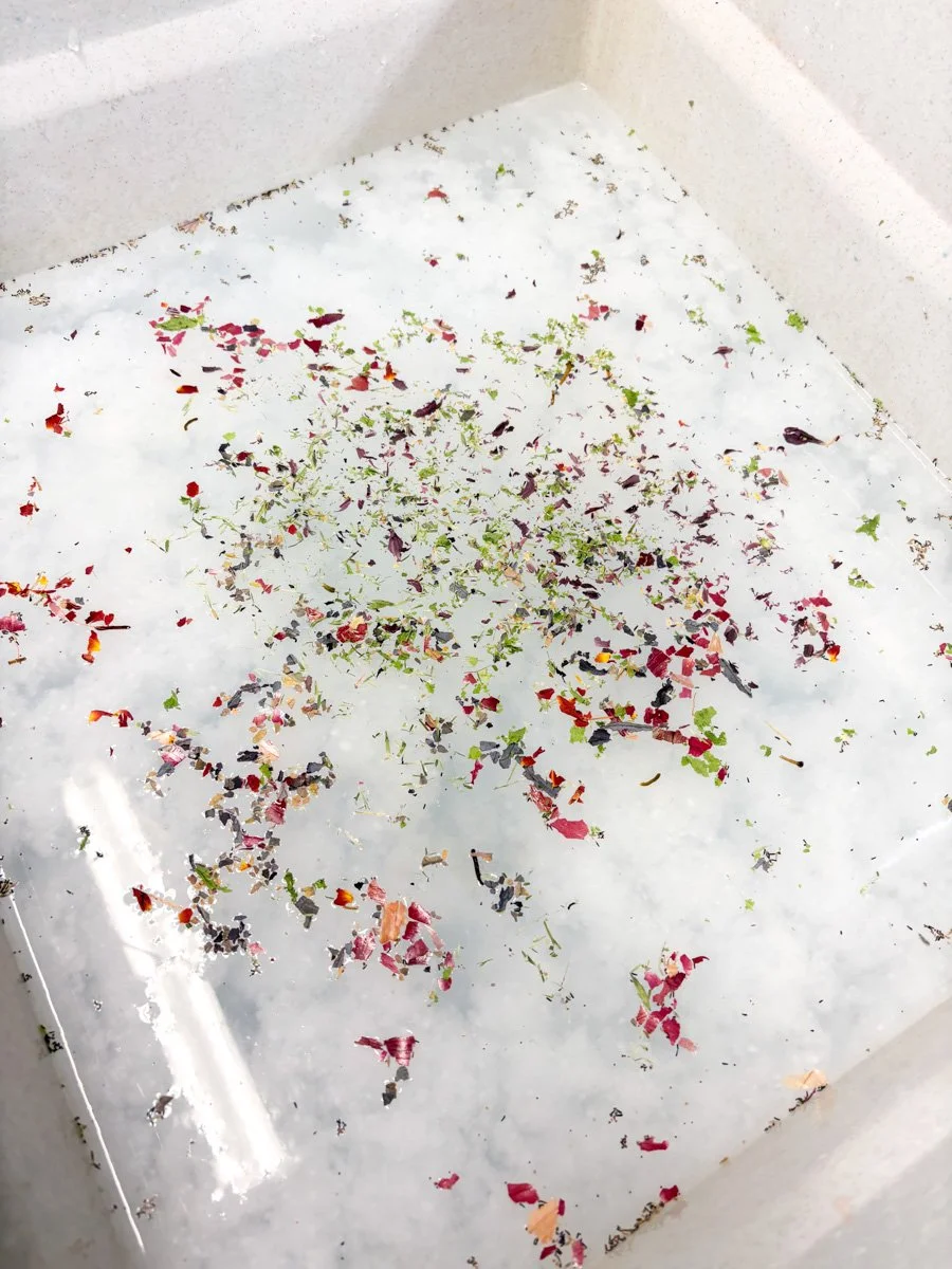 Papermaking vat with pulp and vegetable and  flower petals