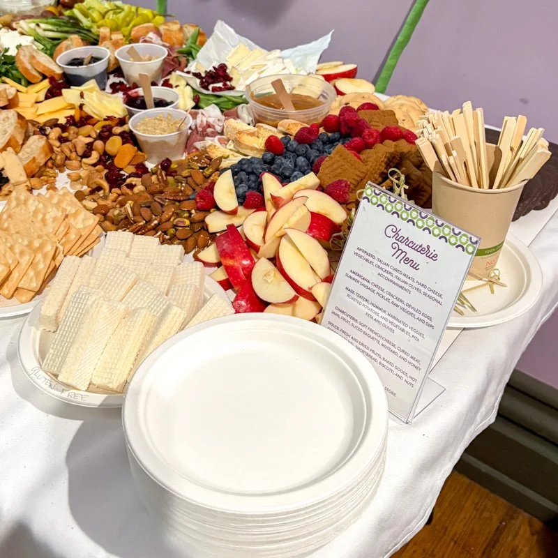 Charcuterie table with sustainable seed paper menu