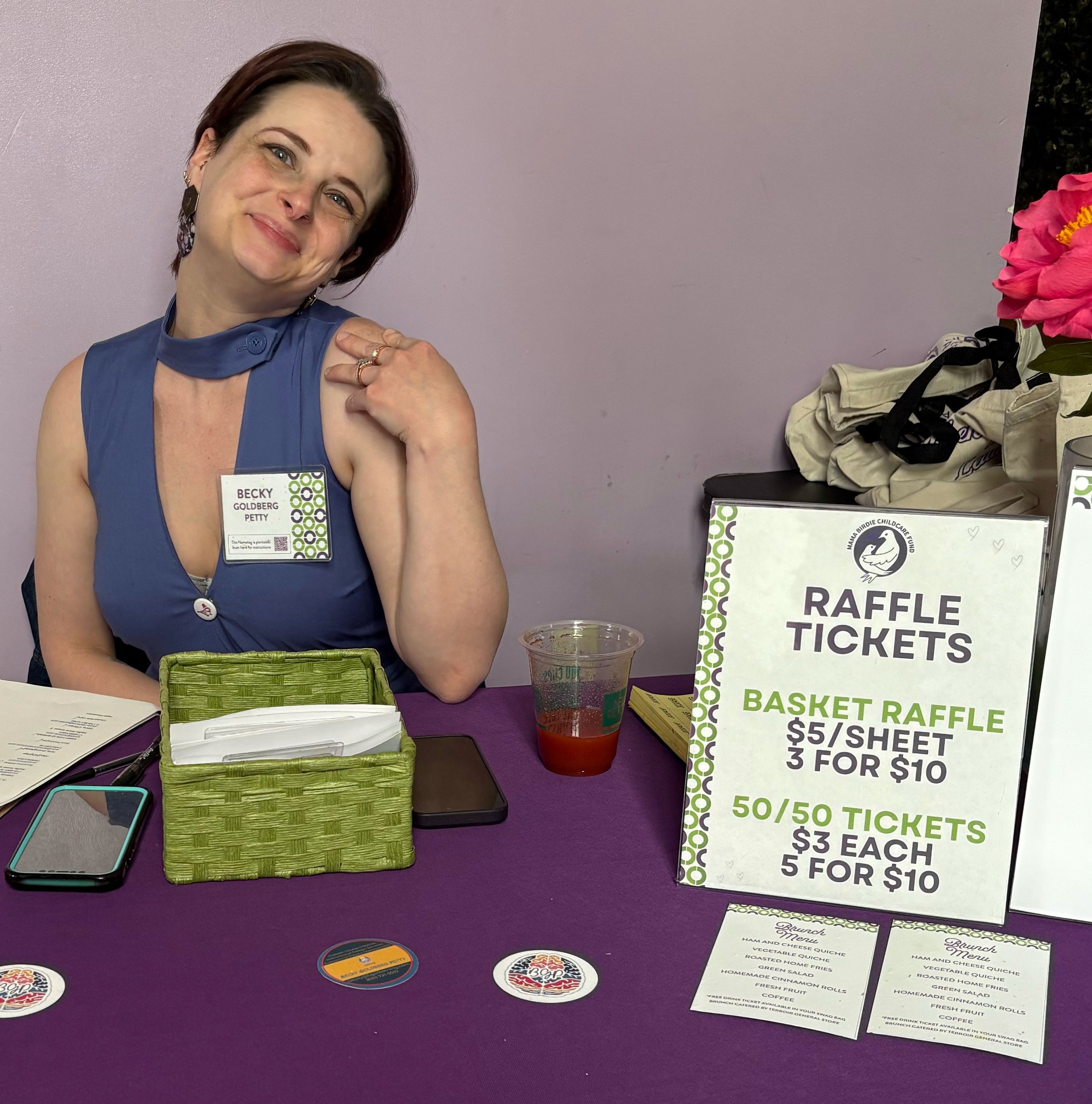 White woman smiling at registration table