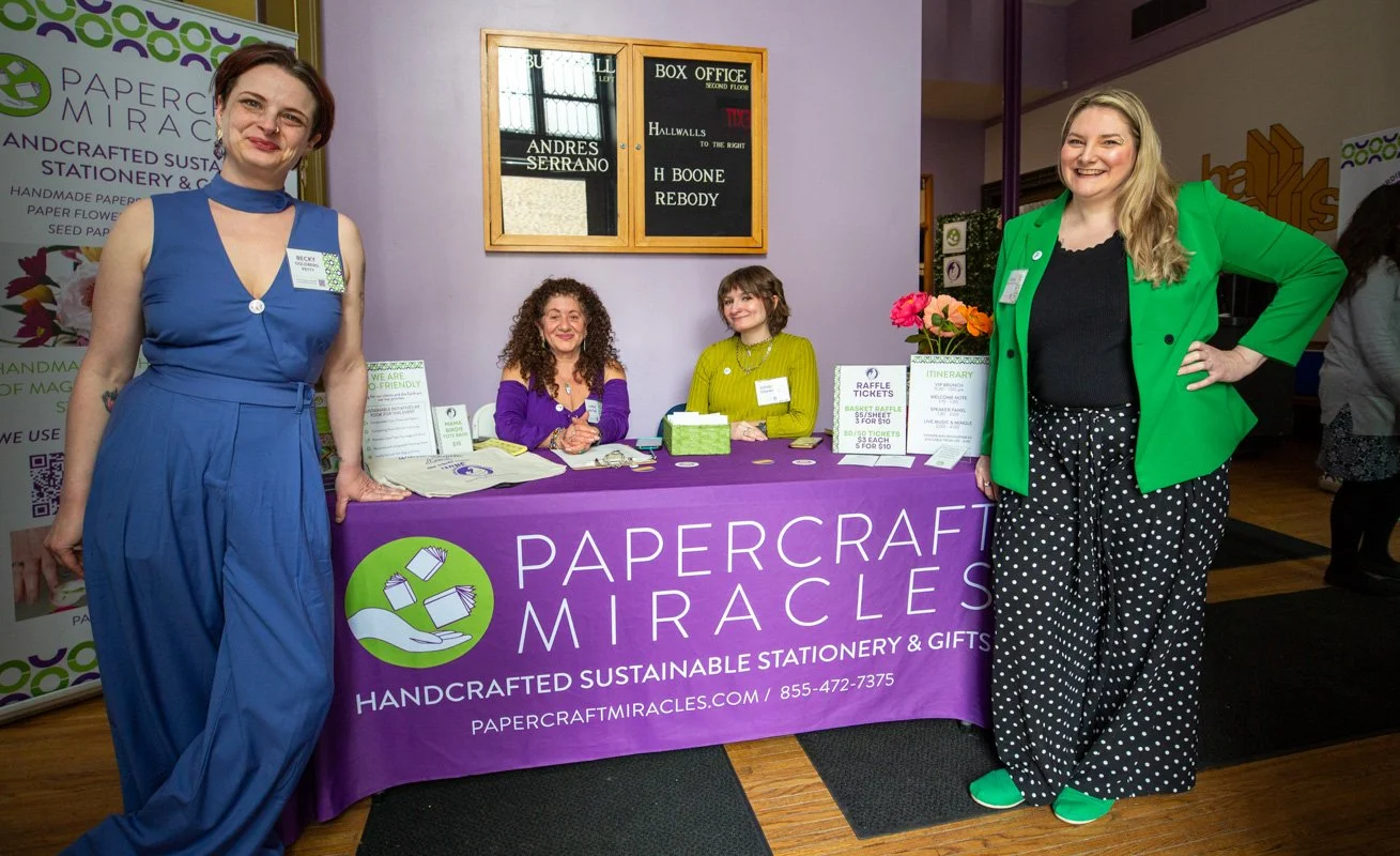 white women at a registration table 