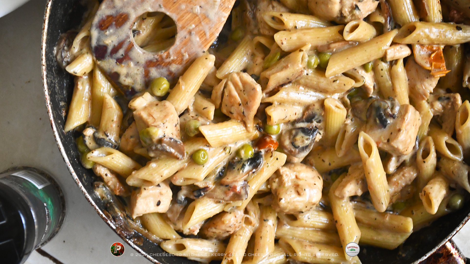 cheeskitch-240201-pizzafetti-penne-chicken-mushrooms-in-pan-top-view-1-1920-hor.jpg