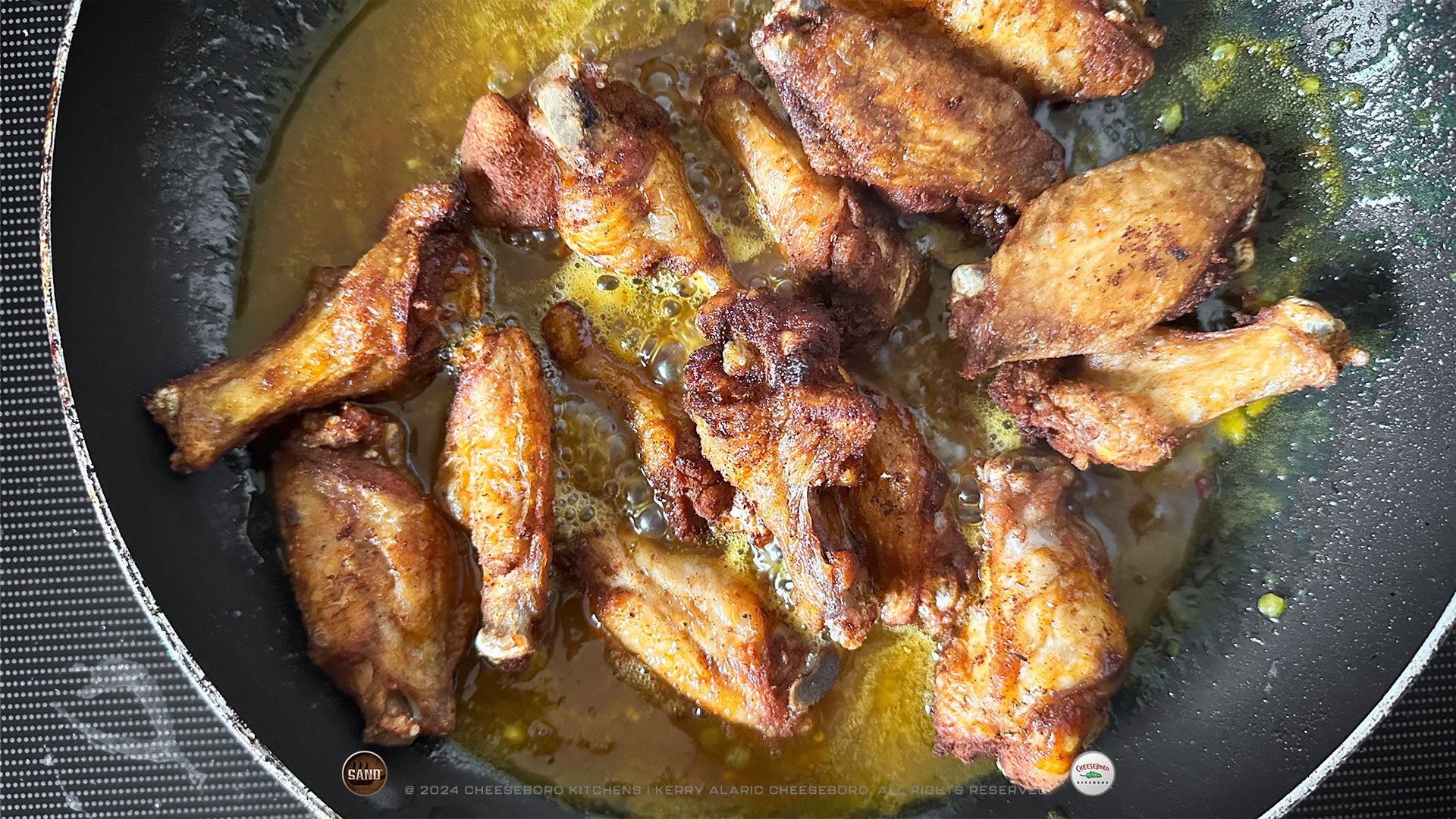 cheeskitch-240228-sand-combo-bajan-sticky-hot-wings-in-sauce-in-pan-1-1920-hor.jpg