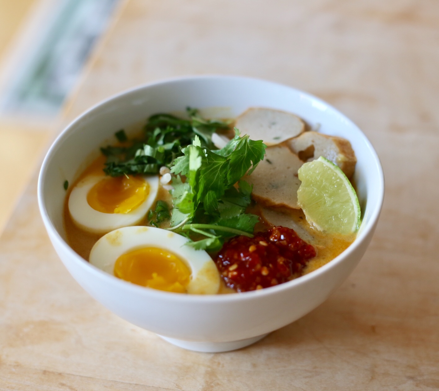 Garnish to your heart's desire. Egg, chili garlic sauce, bean sprouts, laksa leaves, lime - it all works. Enjoy! 