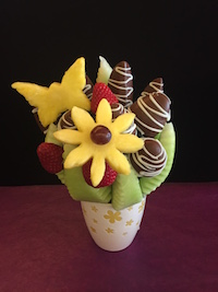 Just A Touch Of Spring One of our smaller bouquets, perfect for any occasion. Honey dew wedges, strawberries and apples with milk chocolate and white swirls. $35 Send Request