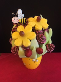 Bee Happy Medium Honeydew melon, strawberries plain and milk chocolate with pink swirls and pineapple daisies $60 Send Request