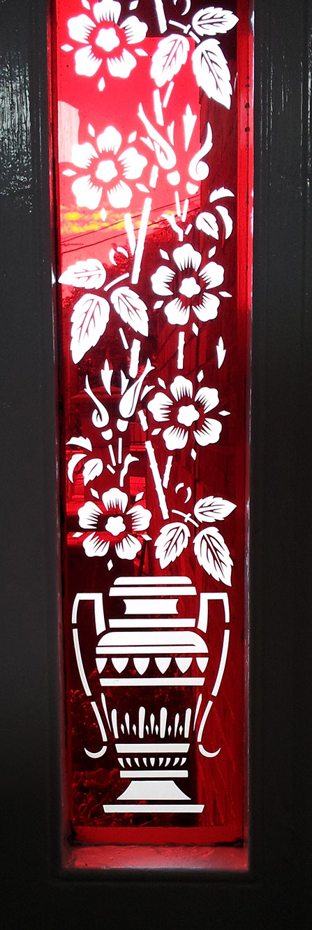 red glass sidelight with sandblasted blossom design