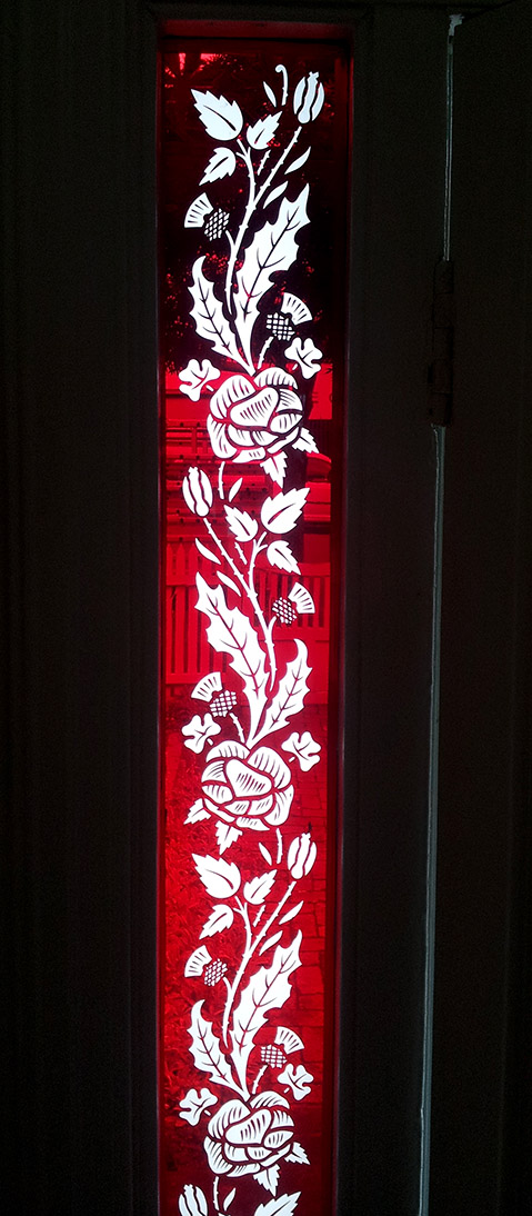 Victorian red sidelight window with sandblasted rose design