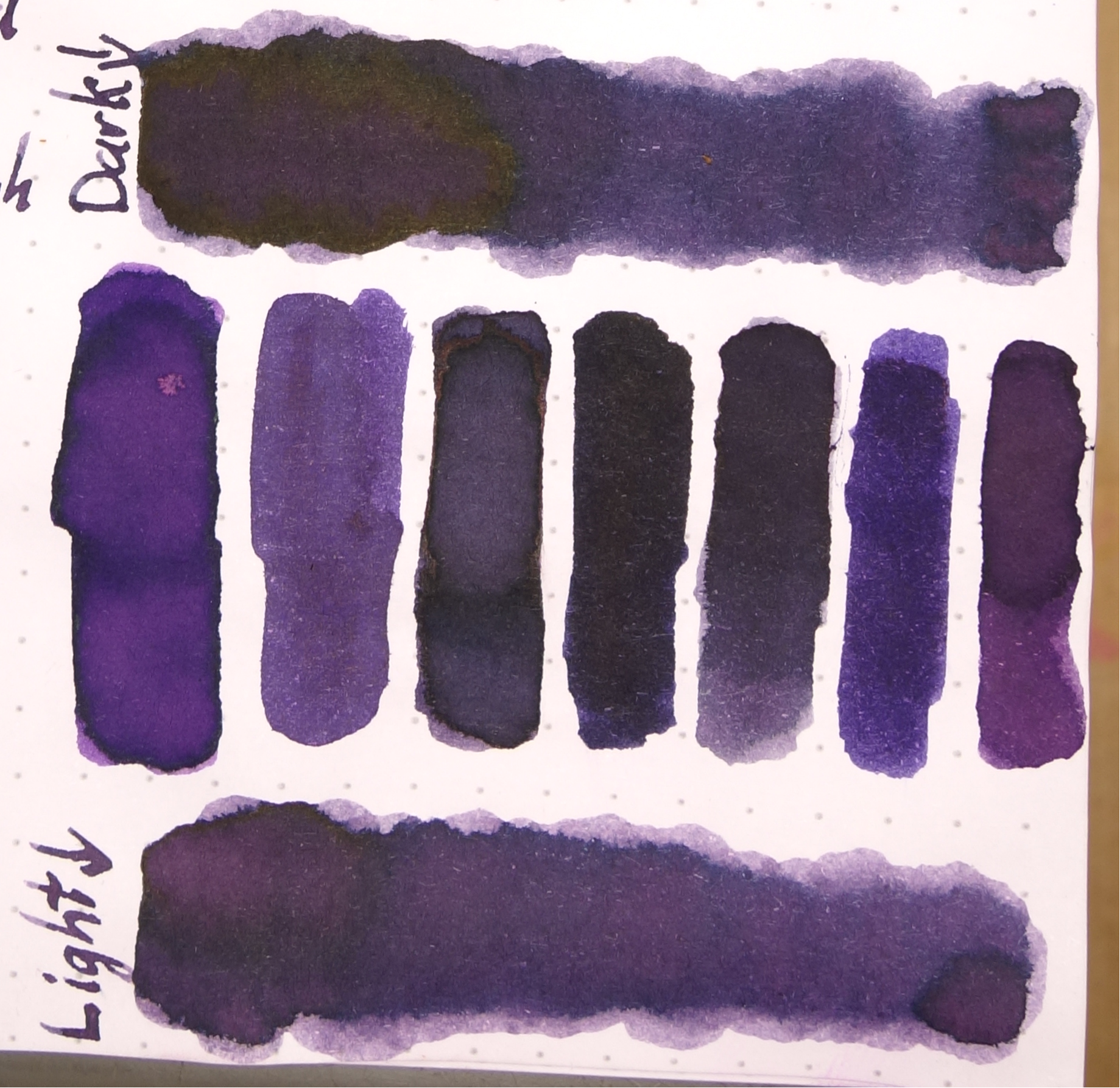 Left to right: 1) Diamine Amazing Amethyst; 2) Noodler's La Reine Mauve; 3) Robert Oster Purple Rock; 4) Private Reserve Ebony Purple; 5) Bungubox Sakanamachi Horoyoi/Tipsy Purple; 6) Sailor Shigure; and 7) Papier Plume Mardi Gras Purple