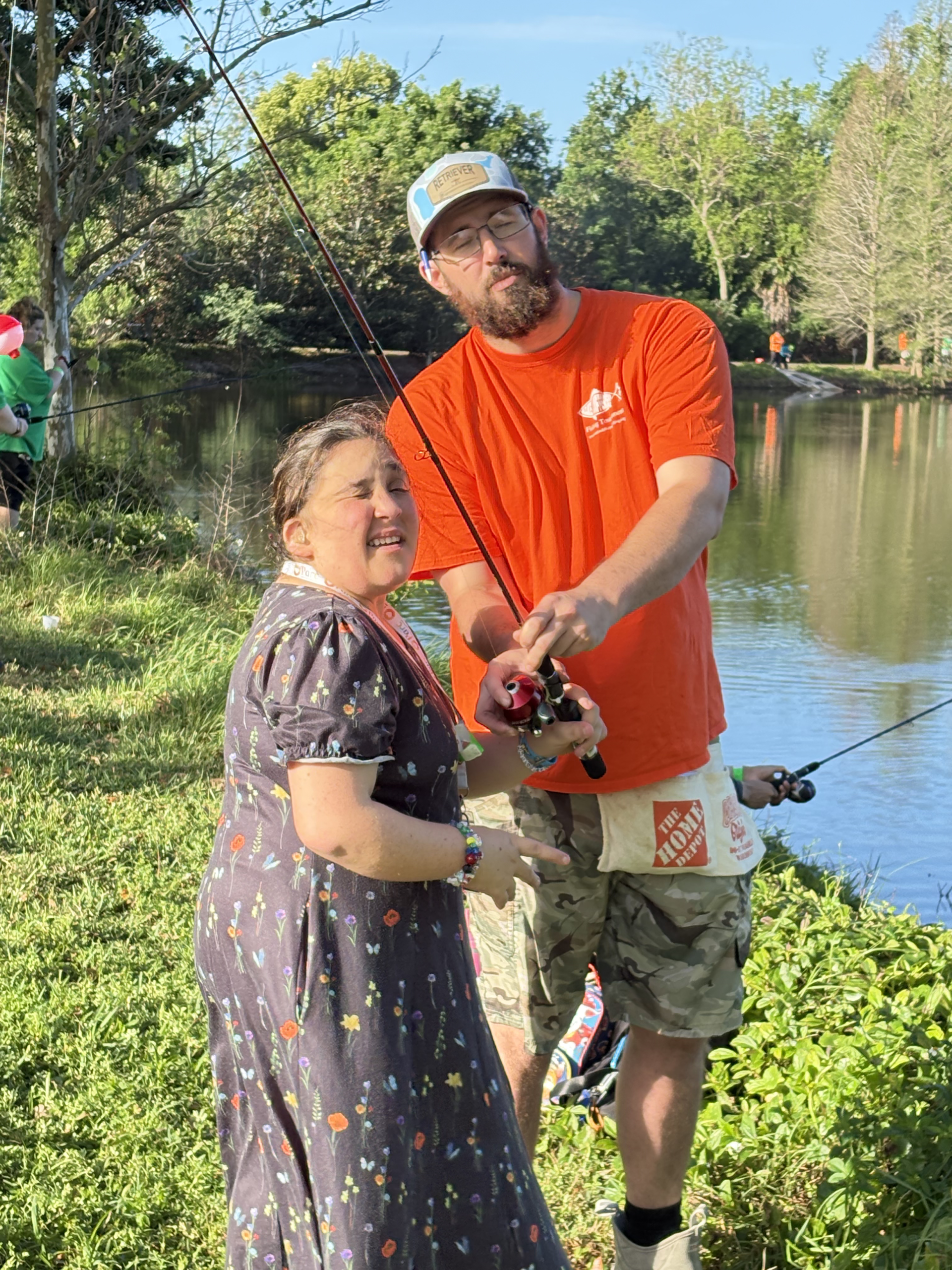 Volunteer helps angler cast