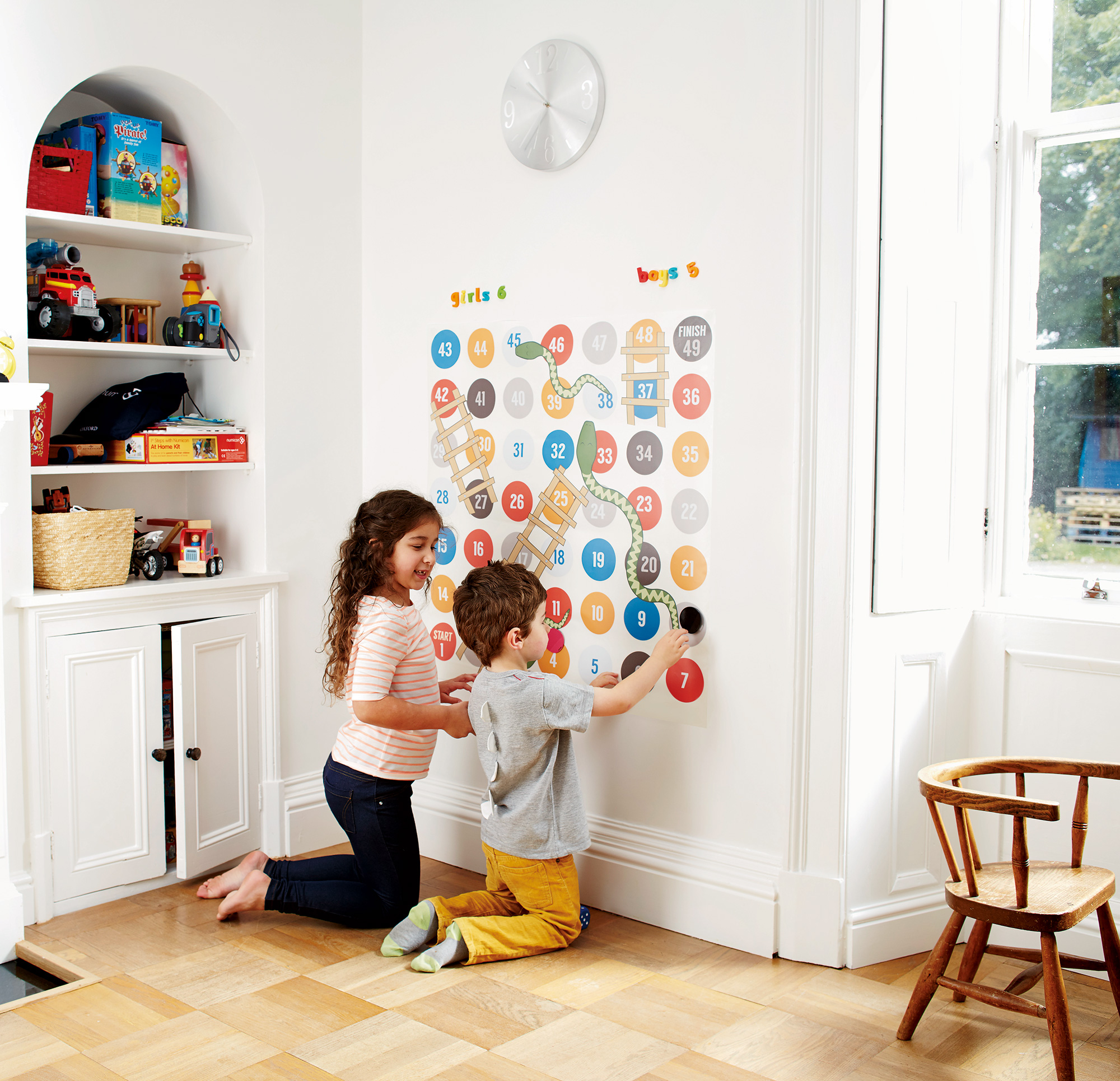 Children playing on magnetic wall