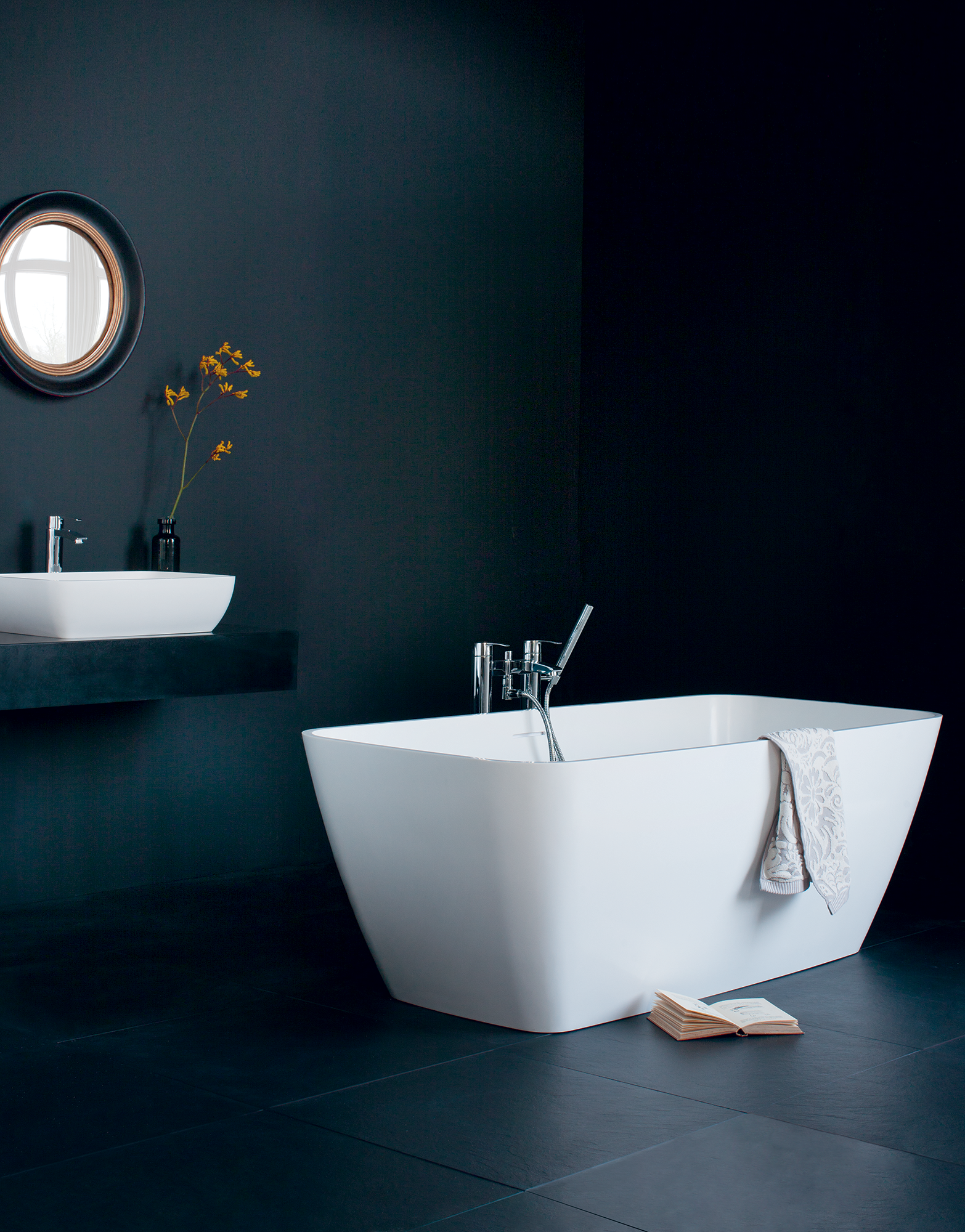 Contemporary bathroom with freestanding bath and wall mounted sink