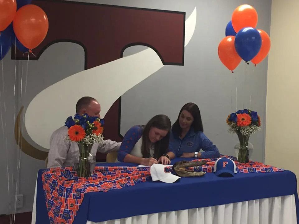 Addie with her parents, Mark and Kristy Baggarly.