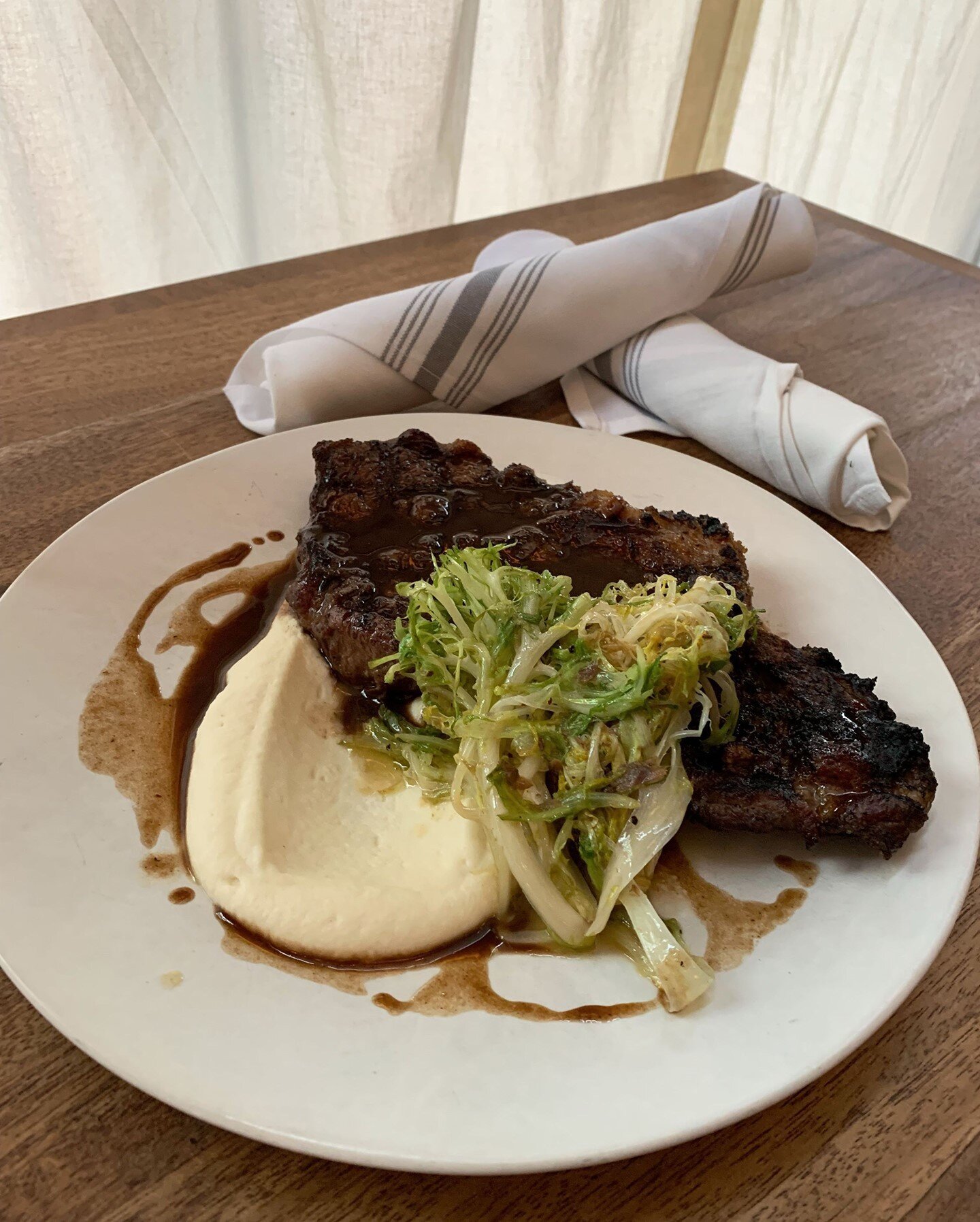 Our Sunday steak special for Dad Day this weekend: 12oz ribeye, celeriac mash, demi, saut&eacute;ed fris&eacute;e. Reservation link in bio.