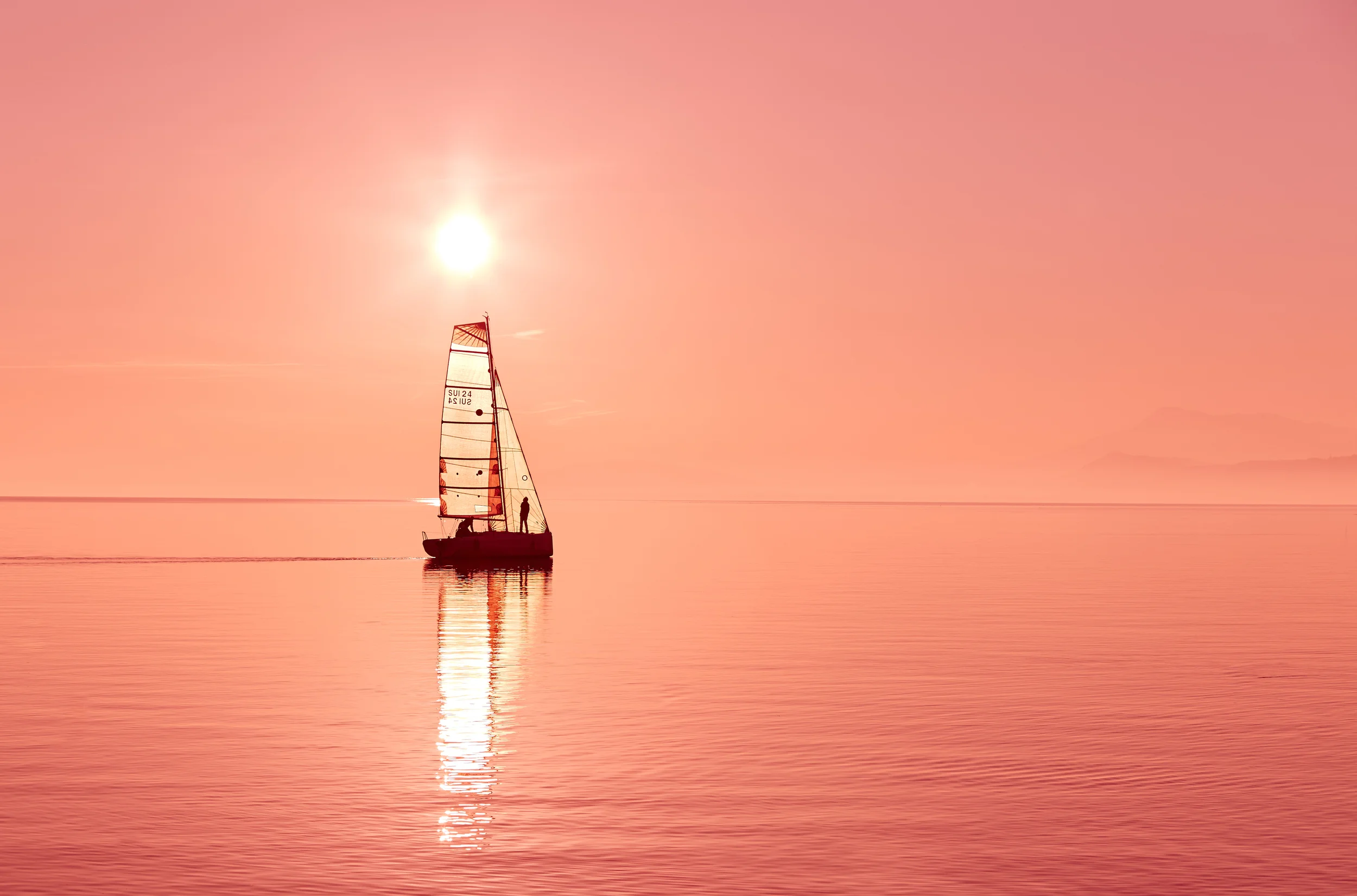 wind-sail-boat-at-sunset.jpg