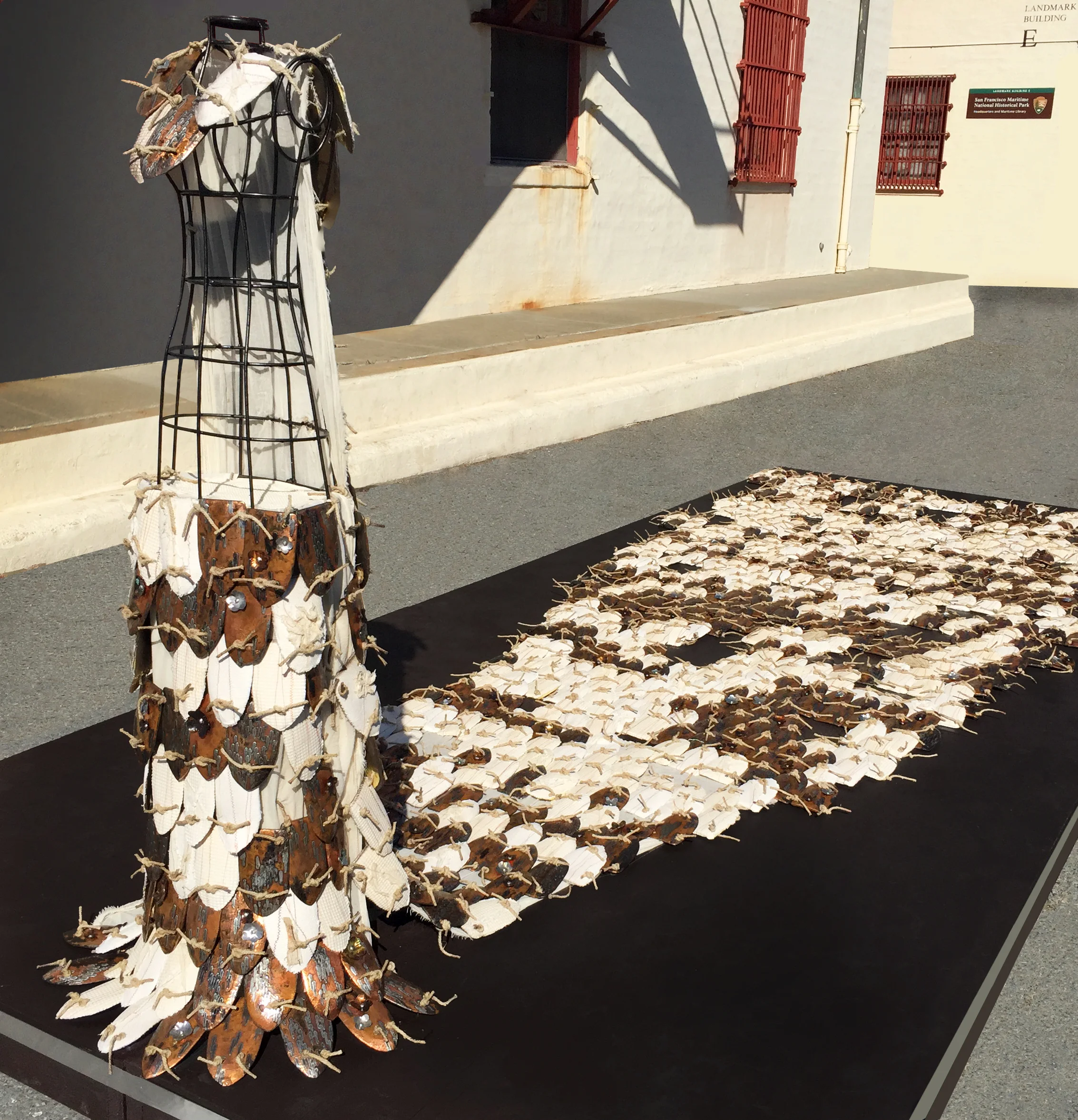 Ties That Bind, 2016, 1000 handmade tiles, silver solder, copper, fiber, wireframe figure, 20 x 8 x 7 feet