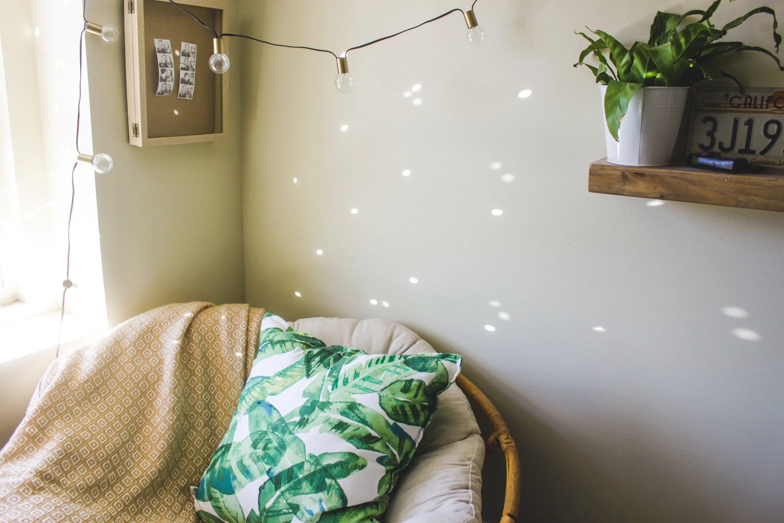 globe lights: target // papasan chair: thrifted from craigslist // banana leaf pillow: target