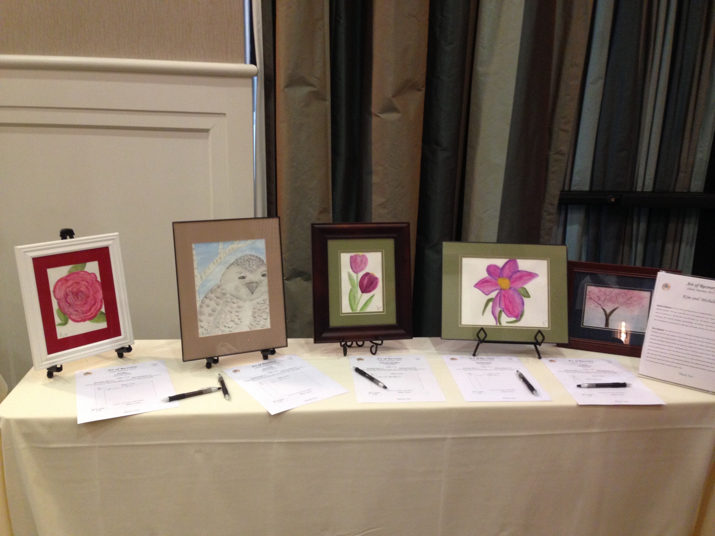 Michele's display of watercolor paintings at last year's AOR silent auction event.