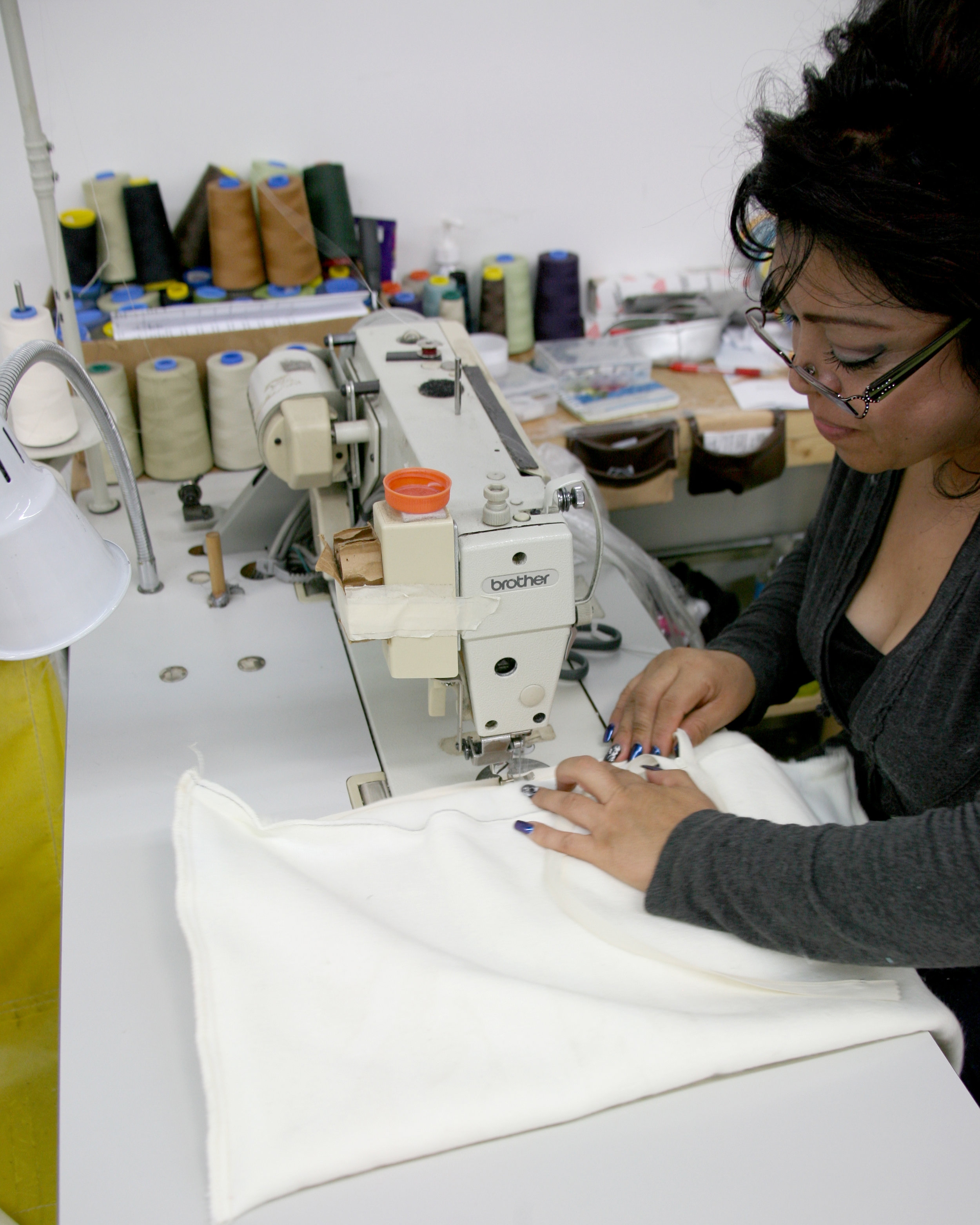 Seamstress expertly inserting an invisible zipper.