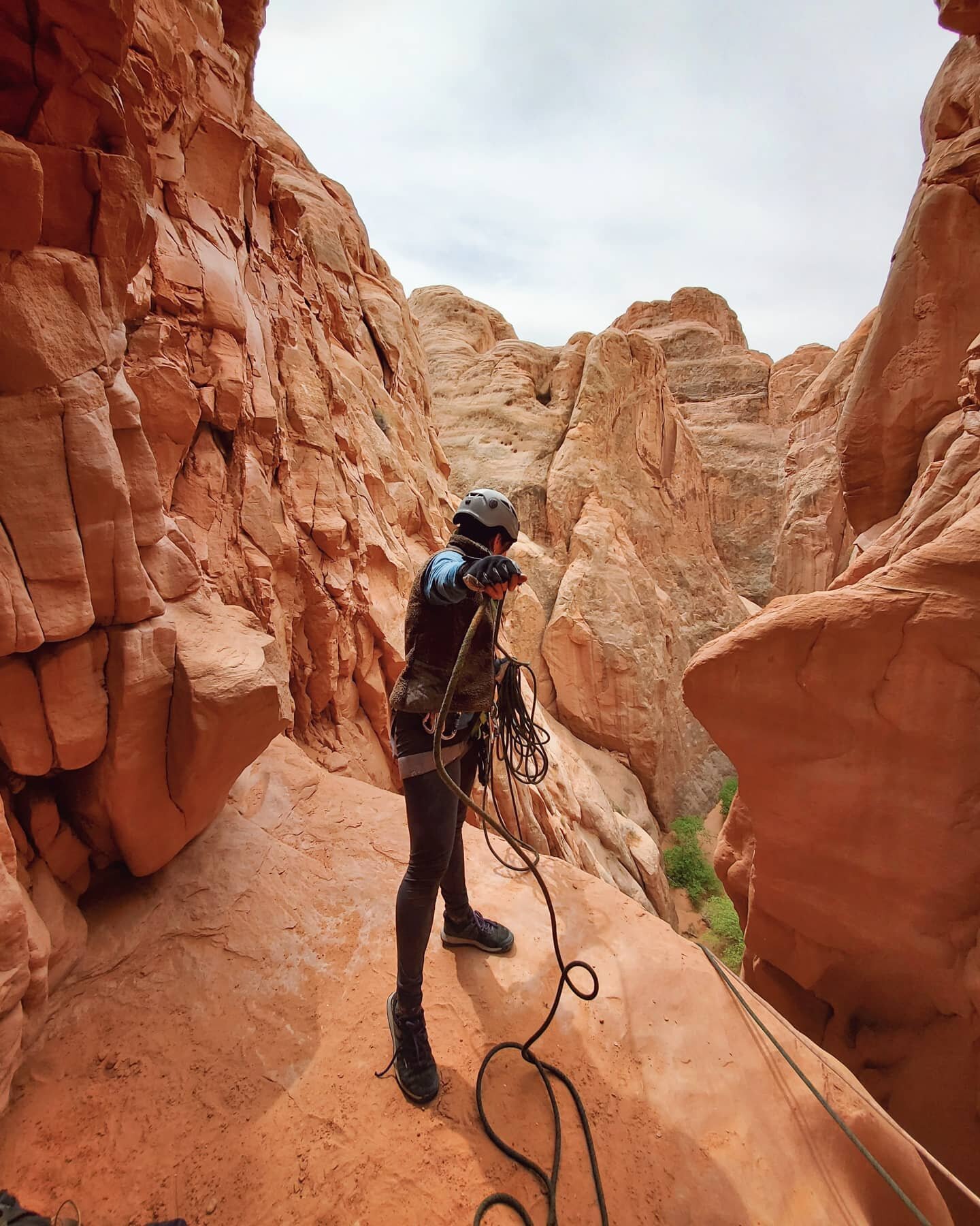 Don't get too close to the edge... we promise you'll have a great view when you're rappelling over it! #utahcanyoneering #moabutah #moabcanyoneering  #rewildyoursol #wildsolretreats #wildsol #moabdesert #moabadventures