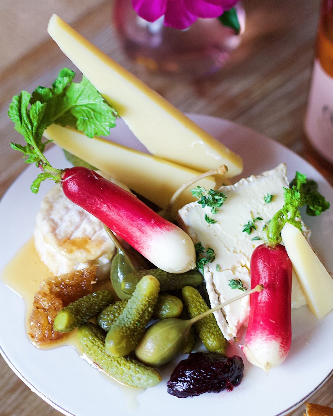 A little appreciation for cheese, a holiday food staple. This cheese board I made incorporates classic French flavors and cheeses with Comt&eacute;, D&eacute;lice, Crottin, cornichon, caper berries, honeycomb and French breakfast radish. I paired it 