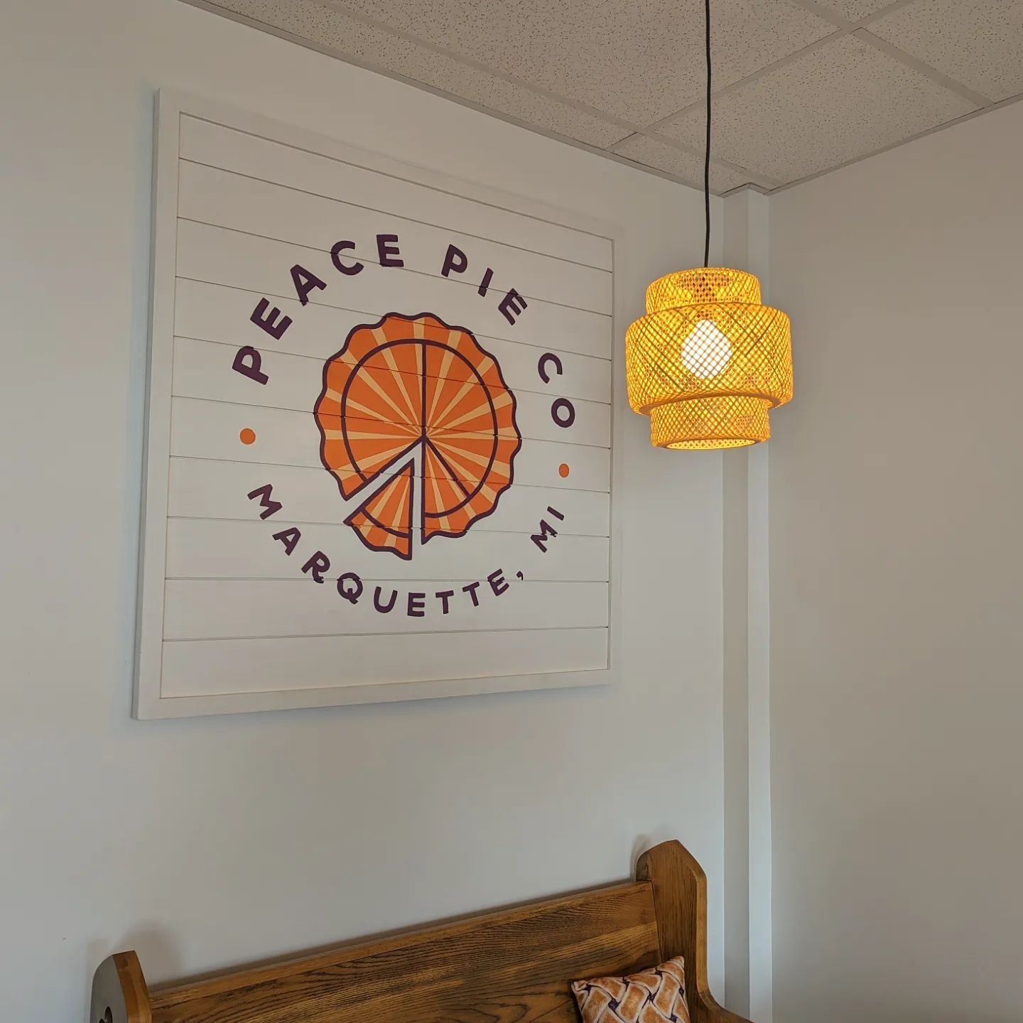 Hand painted sign for @peacepiecompany at their new space! I designed this logo years ago, so it's exciting to see Lorri and her team finally have their own storefront ☮️