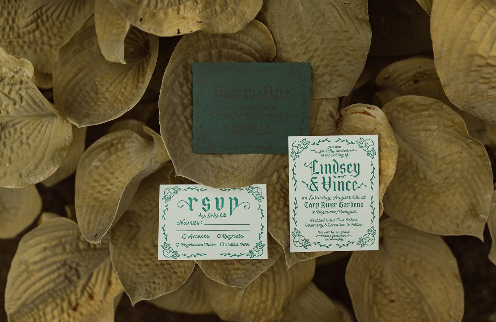 Save the Date, rsvp, wedding invitation in letterpress hand lettered in a blackletter medieval style with peonies and foliage